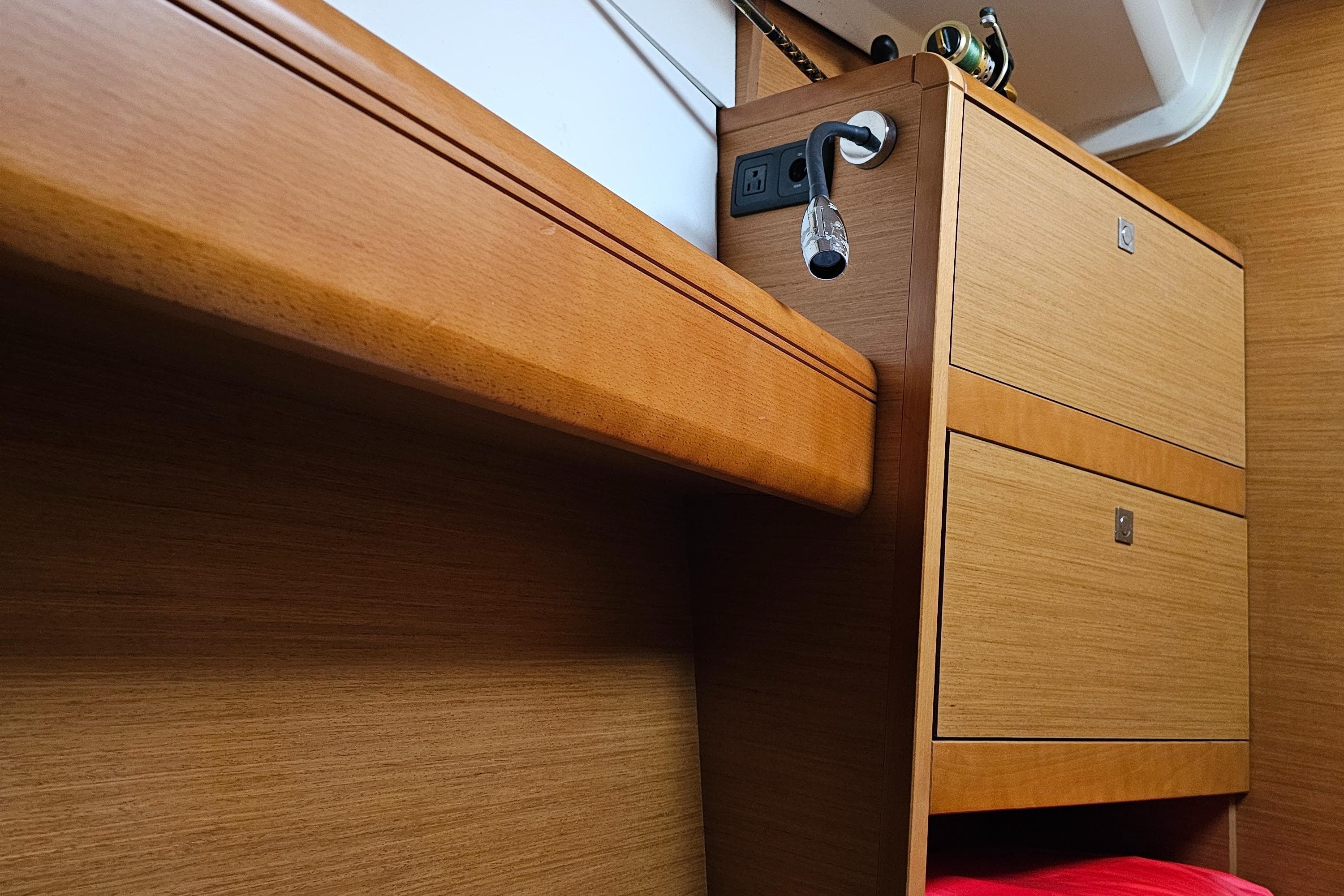Interior of 2016 Jeanneau 379 sailboat with wooden cabinetry and modern design.