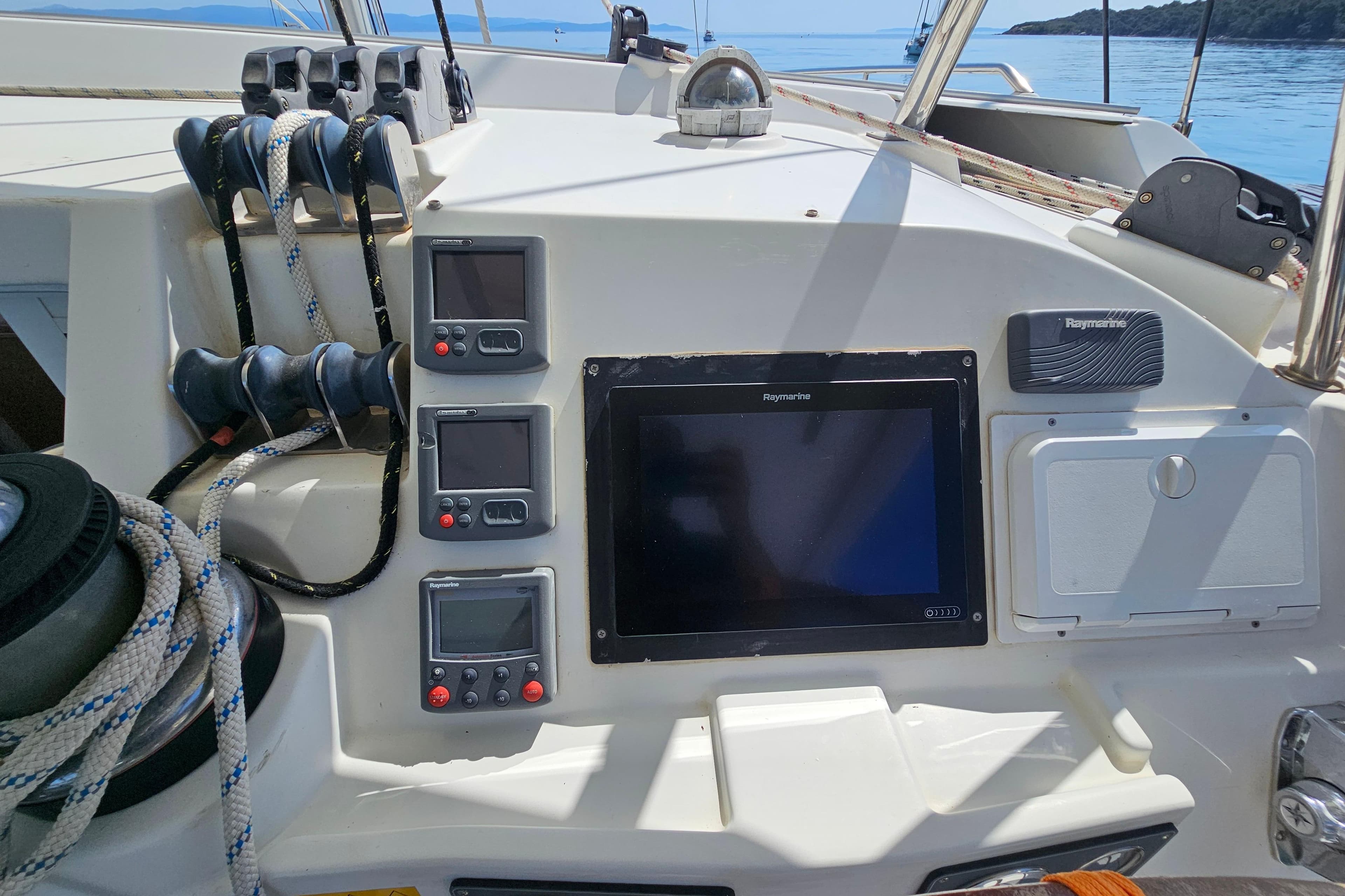 Control panel of a 2008 Lagoon 420 yacht with navigation instruments and ropes.