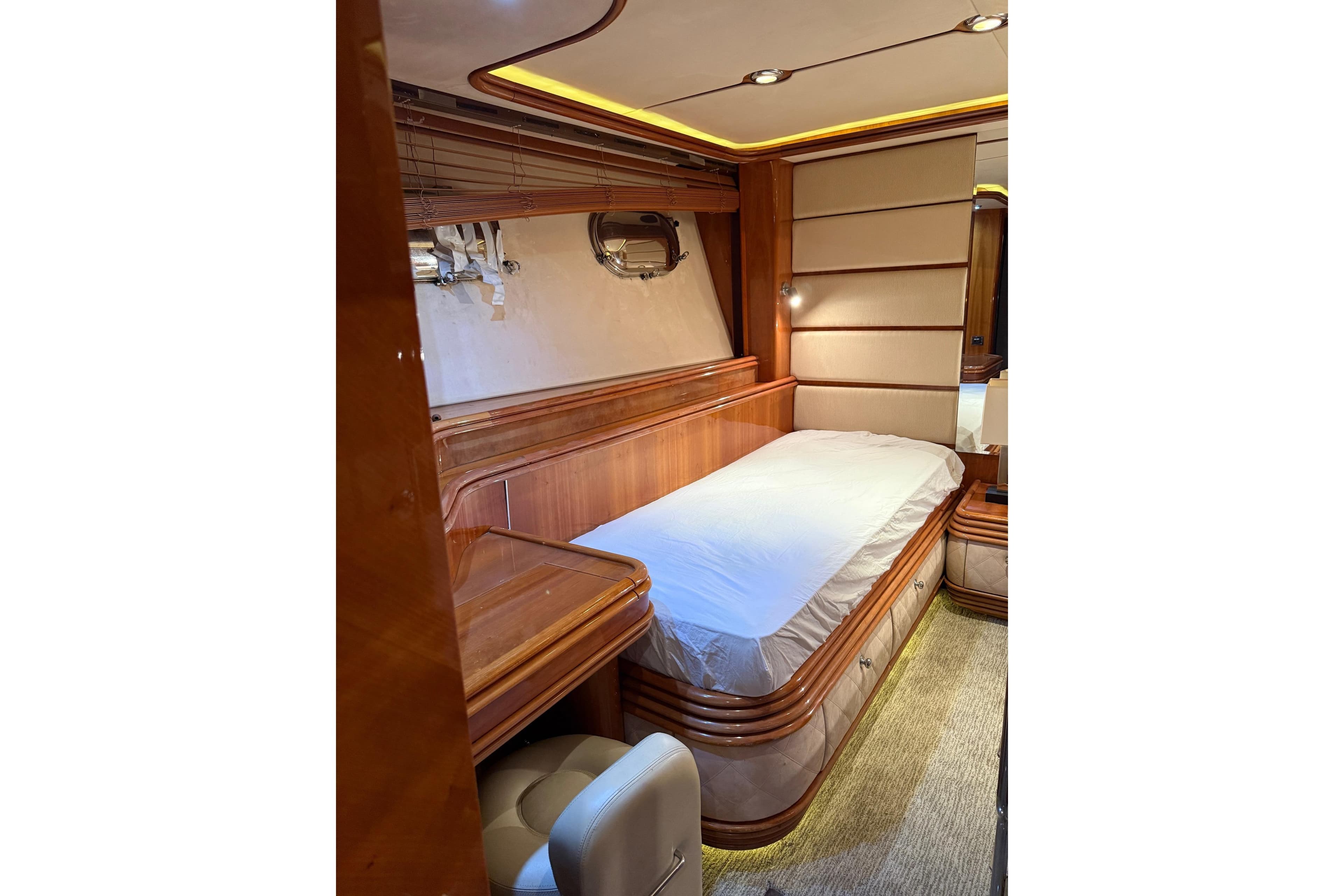 Luxurious cabin interior of 2002 Sunseeker 105 Yacht with elegant wood finishes.