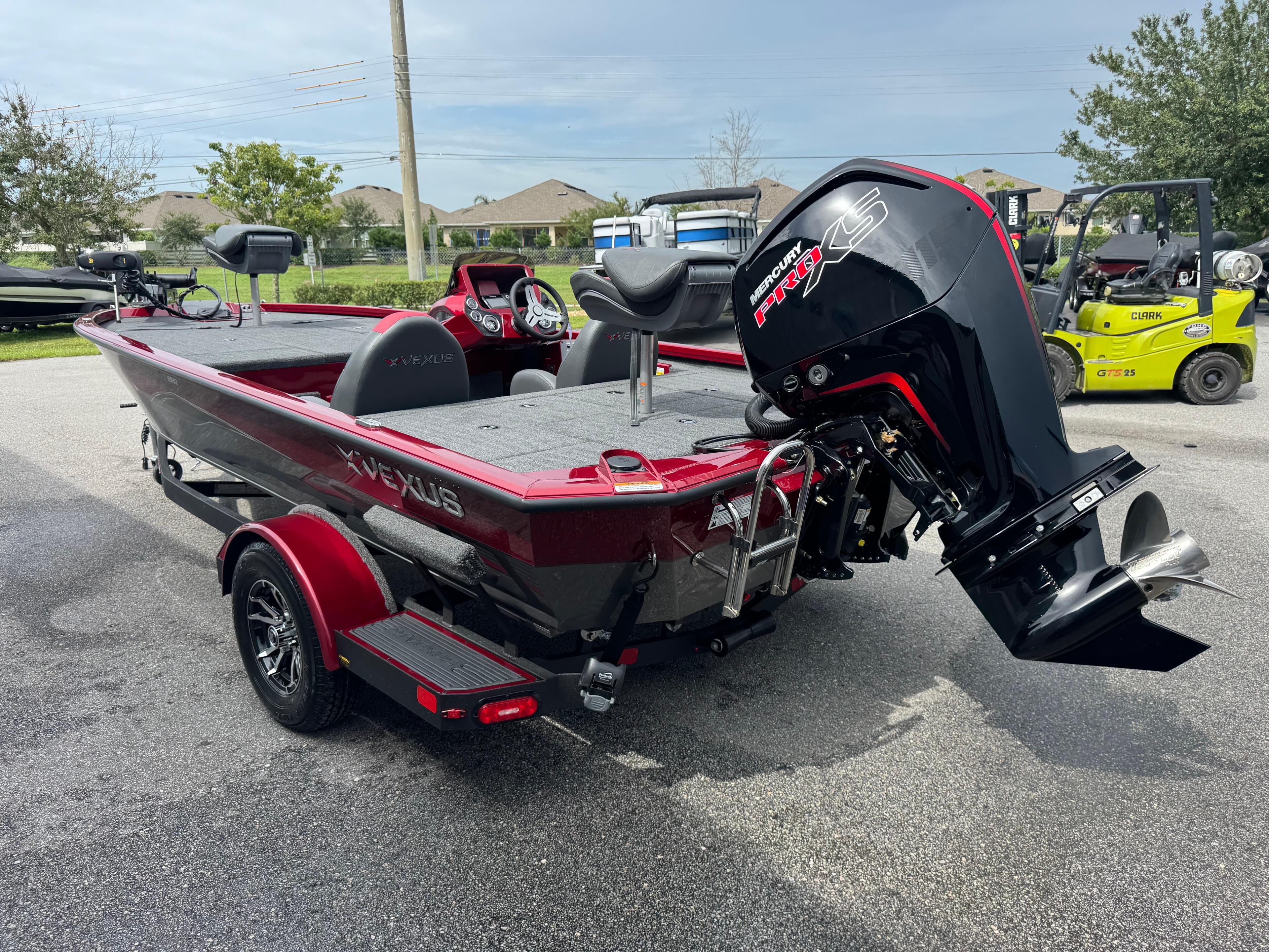 2026 Vexus AVX1880 boat with Mercury Pro XS engine, parked outdoors.