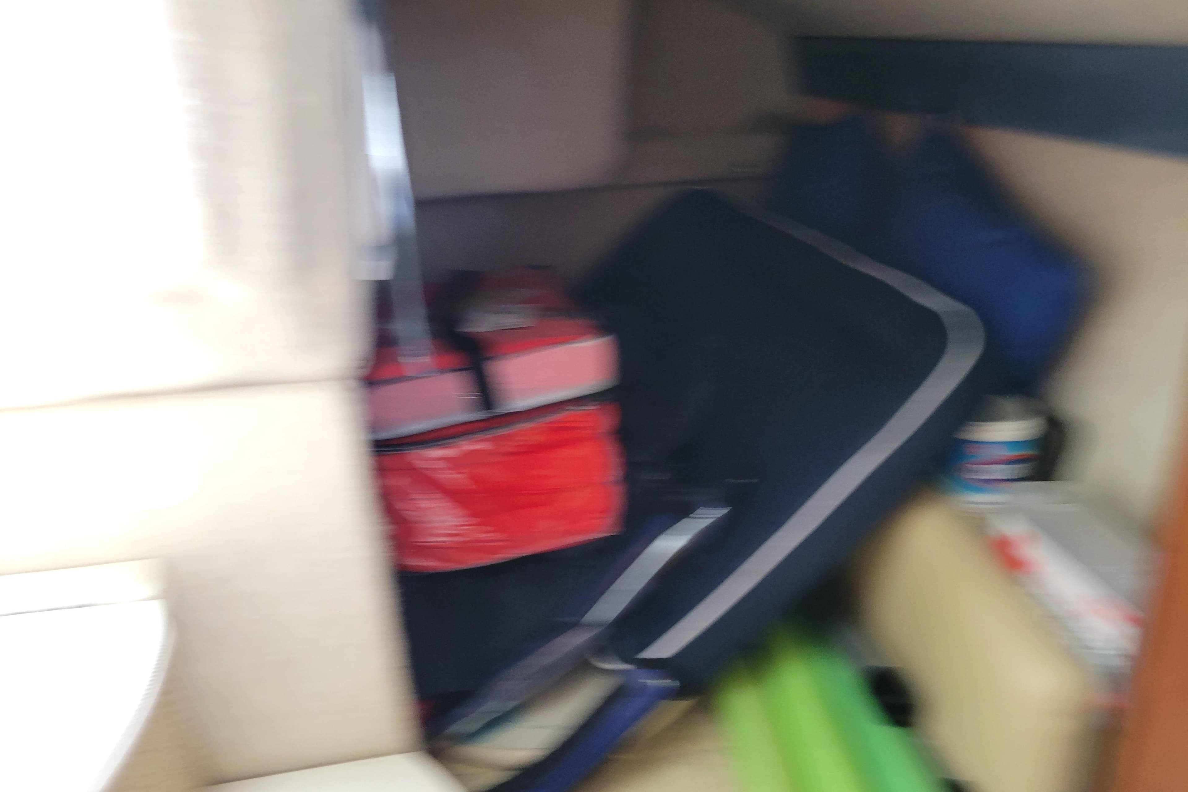 Interior of a 2007 Bayliner 245 Cruiser with stored items and equipment.