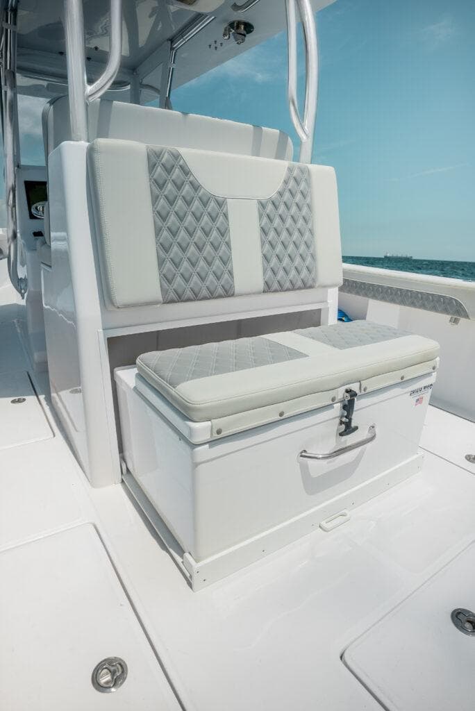 2025 Front Runner 33 CC Custom boat seating with storage, featuring quilted upholstery and sleek design.