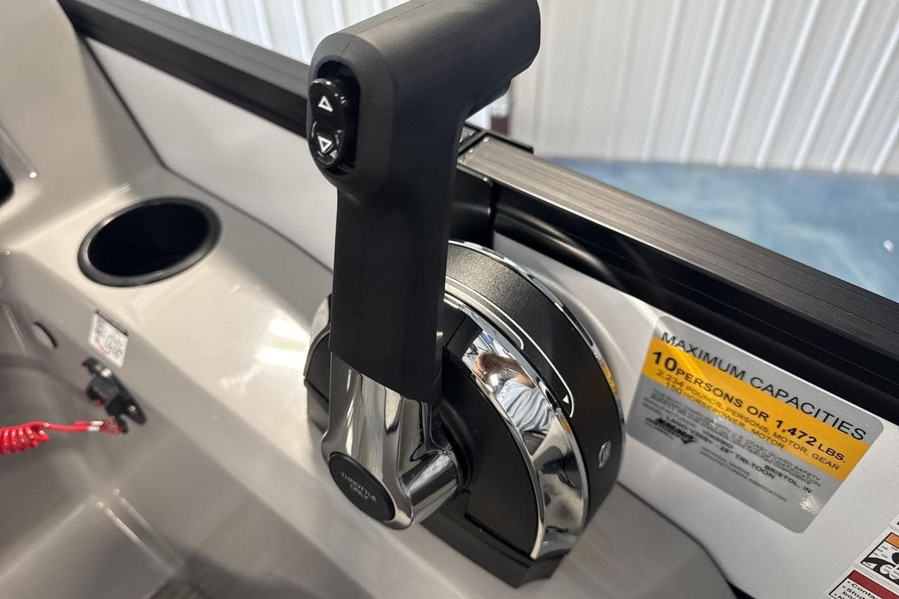 Throttle control of 2026 Viaggio V20S boat, showing capacity label and cup holder.