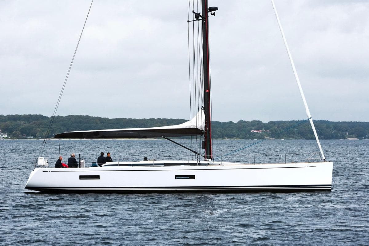 Sailing yacht Nautor Swan 60 FD 2009 on calm waters with crew onboard.