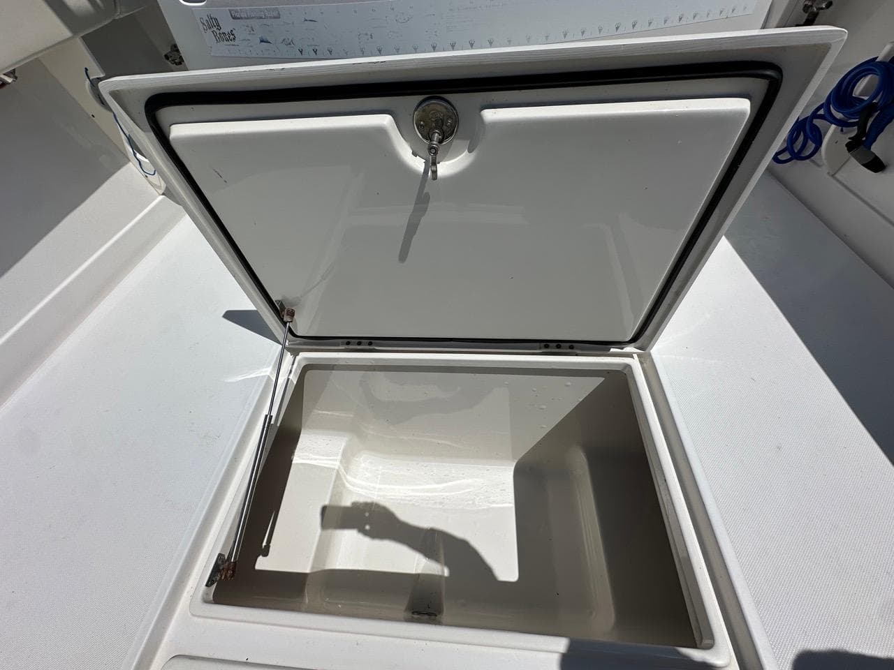 Open storage compartment on a 2009 Jupiter 29 FS CC boat.