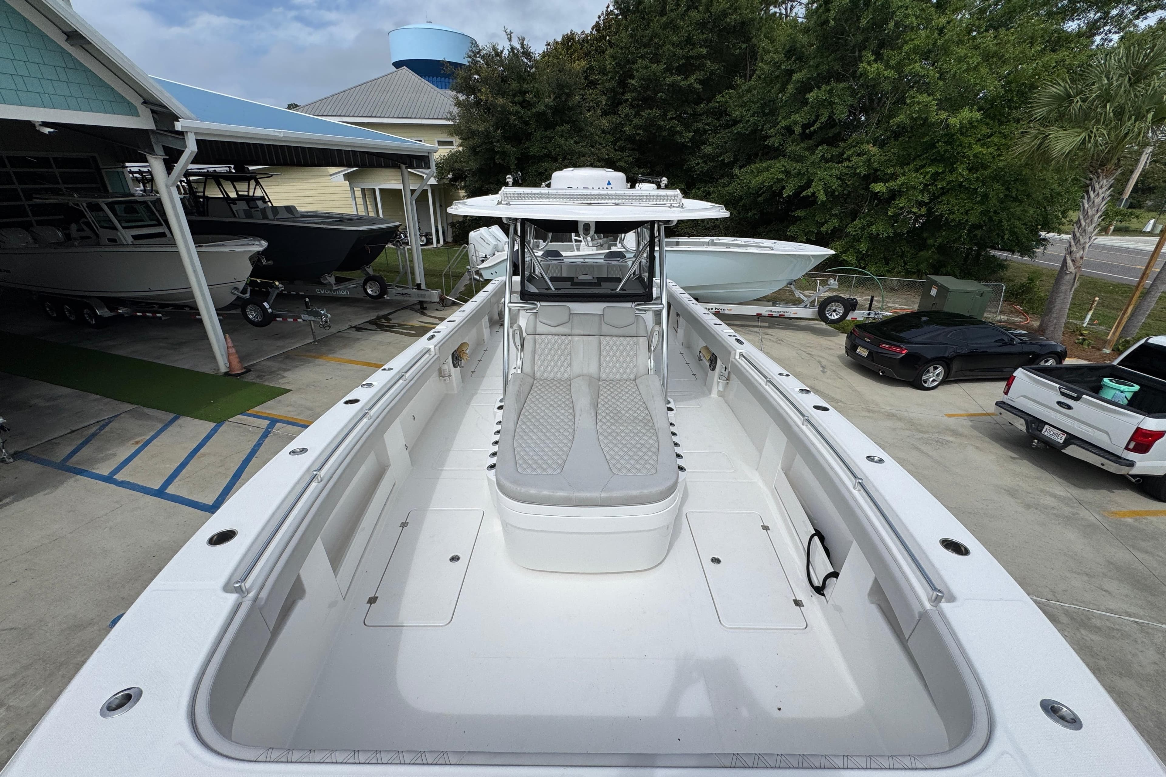 2020 Invincible 35 Catamaran in a marina, showcasing spacious deck and sleek design.