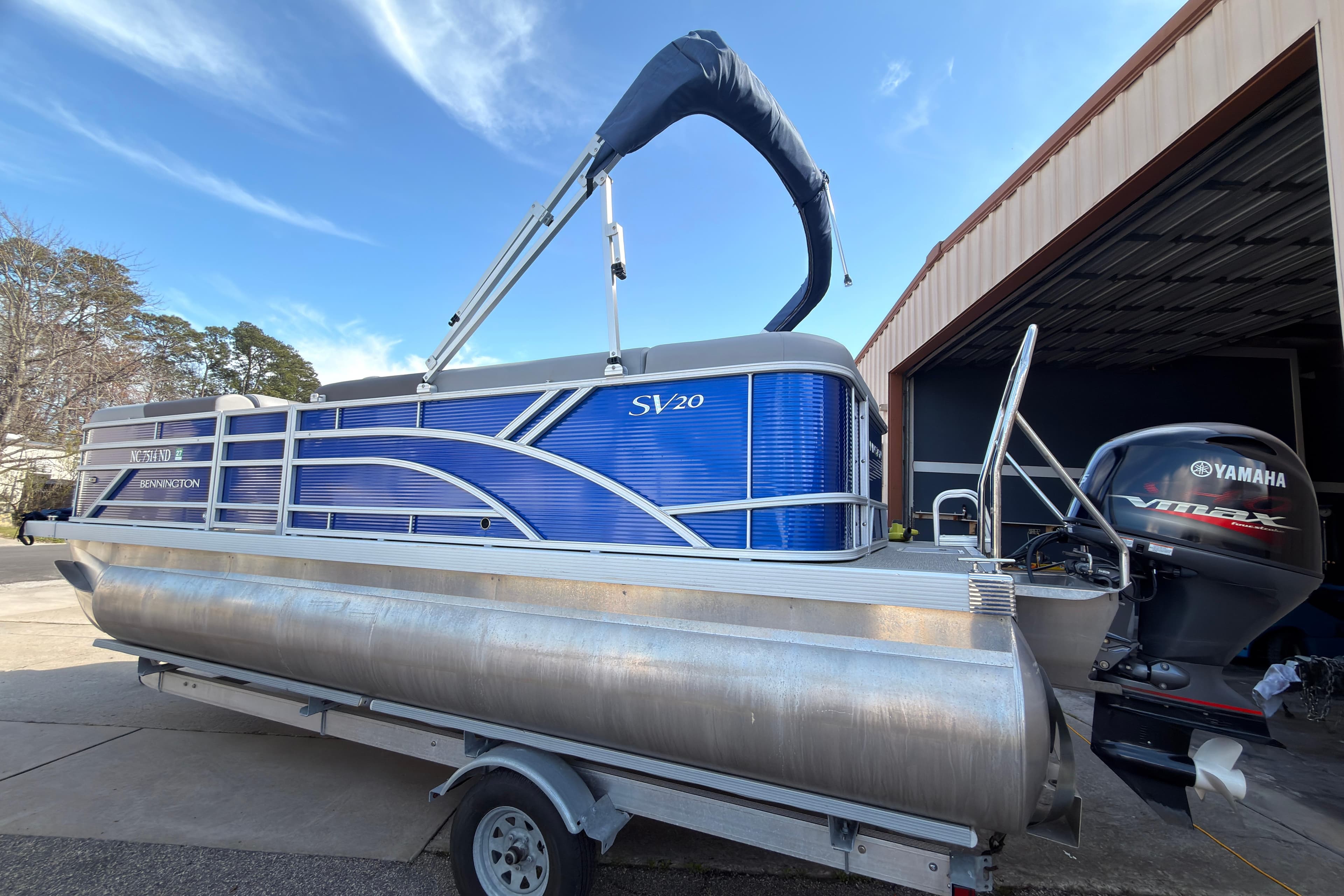 2024 Bennington SVL pontoon boat with Yamaha VMAX engine on trailer.