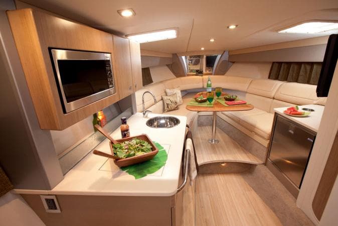 Manufacturer Provided Image: Interior of 2015 Formula 350 Sun Sport yacht with modern kitchen and dining area.