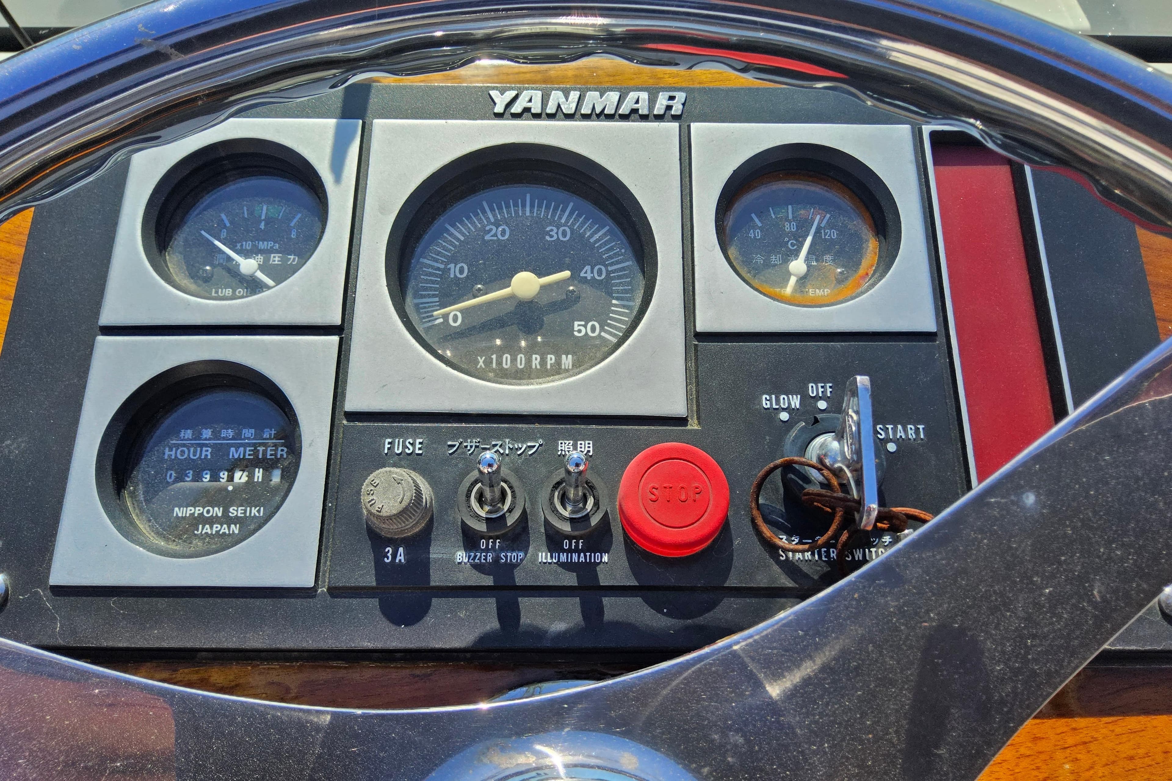 Yanmar control panel on 2010 Grey Barn Boatworks North Shore 22, featuring gauges and switches.