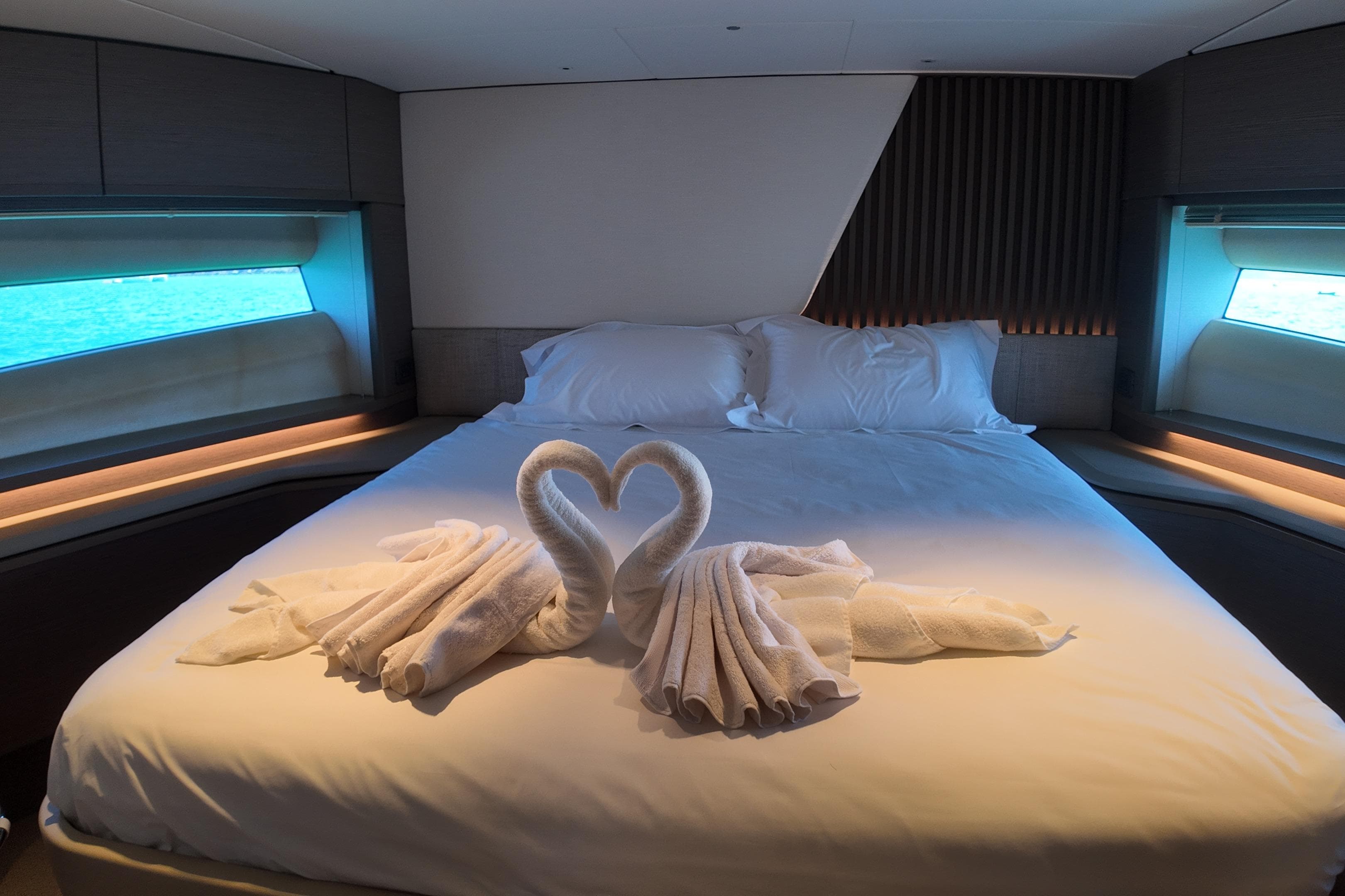 Luxurious Princess Y72 yacht bedroom with swan towel art, 2023 model.