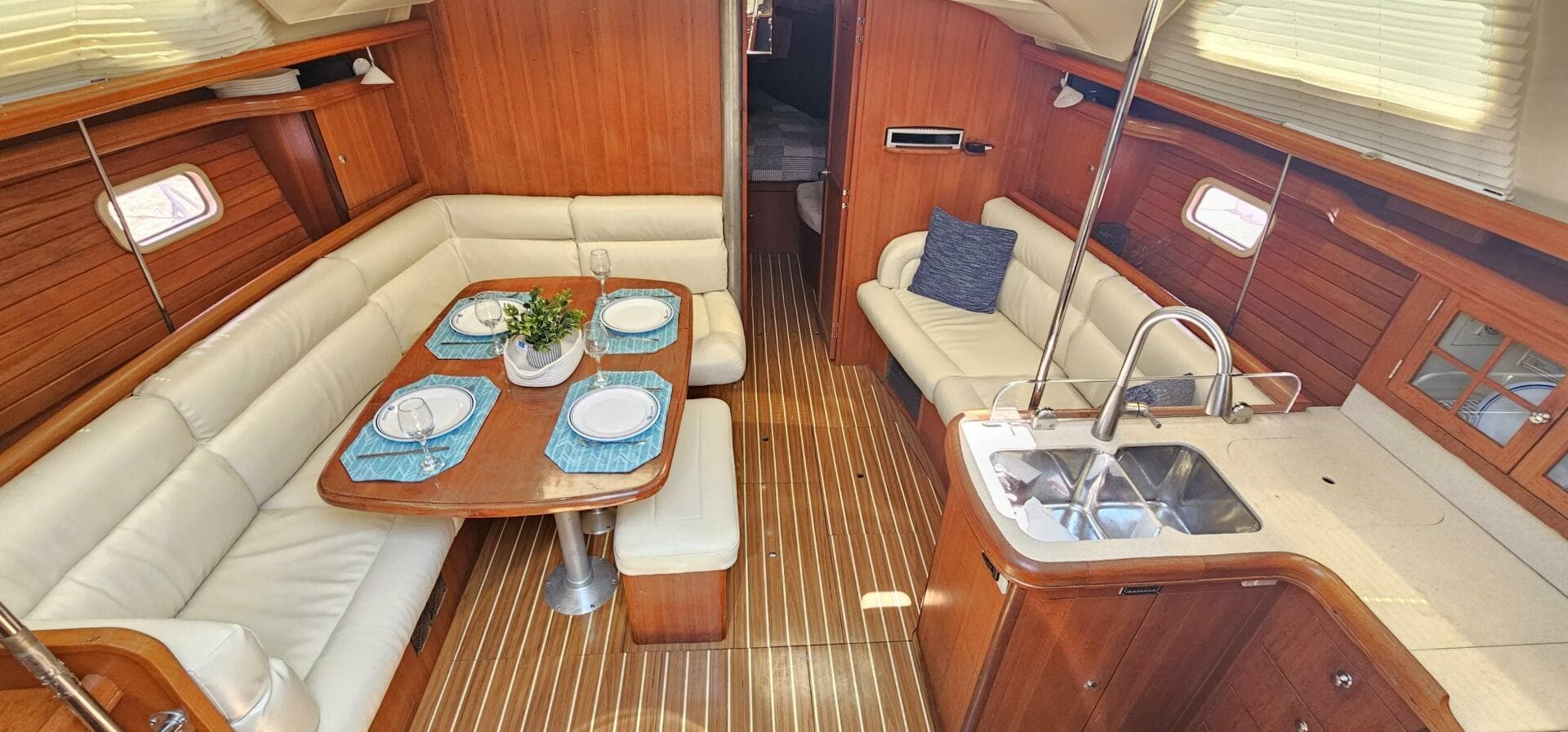 Luxurious 2007 Hunter 45 Center Cockpit interior with elegant dining area and modern kitchen.