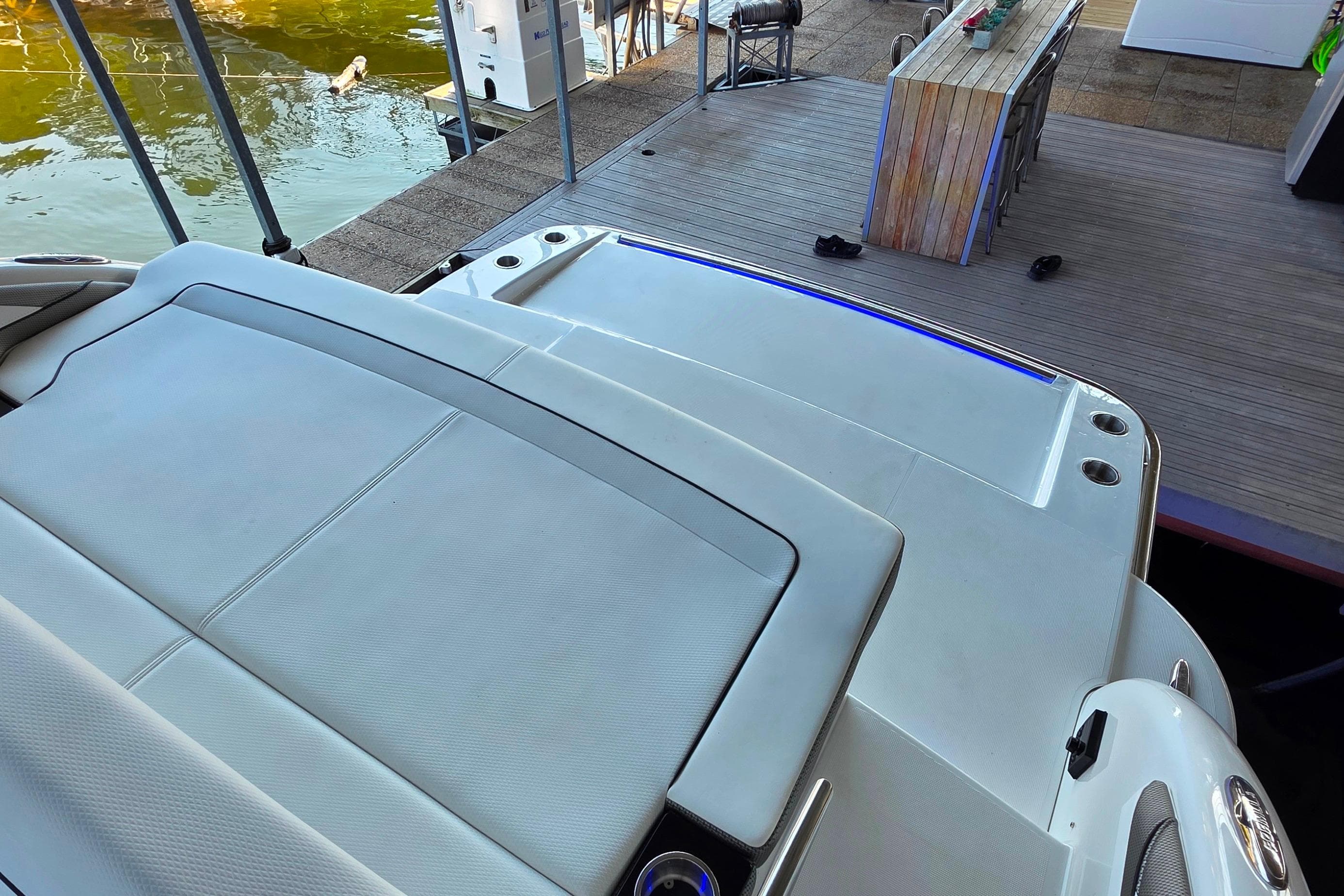 2026 Formula 350 Crossover Bowrider I/O at dock, featuring spacious seating and sleek design.
