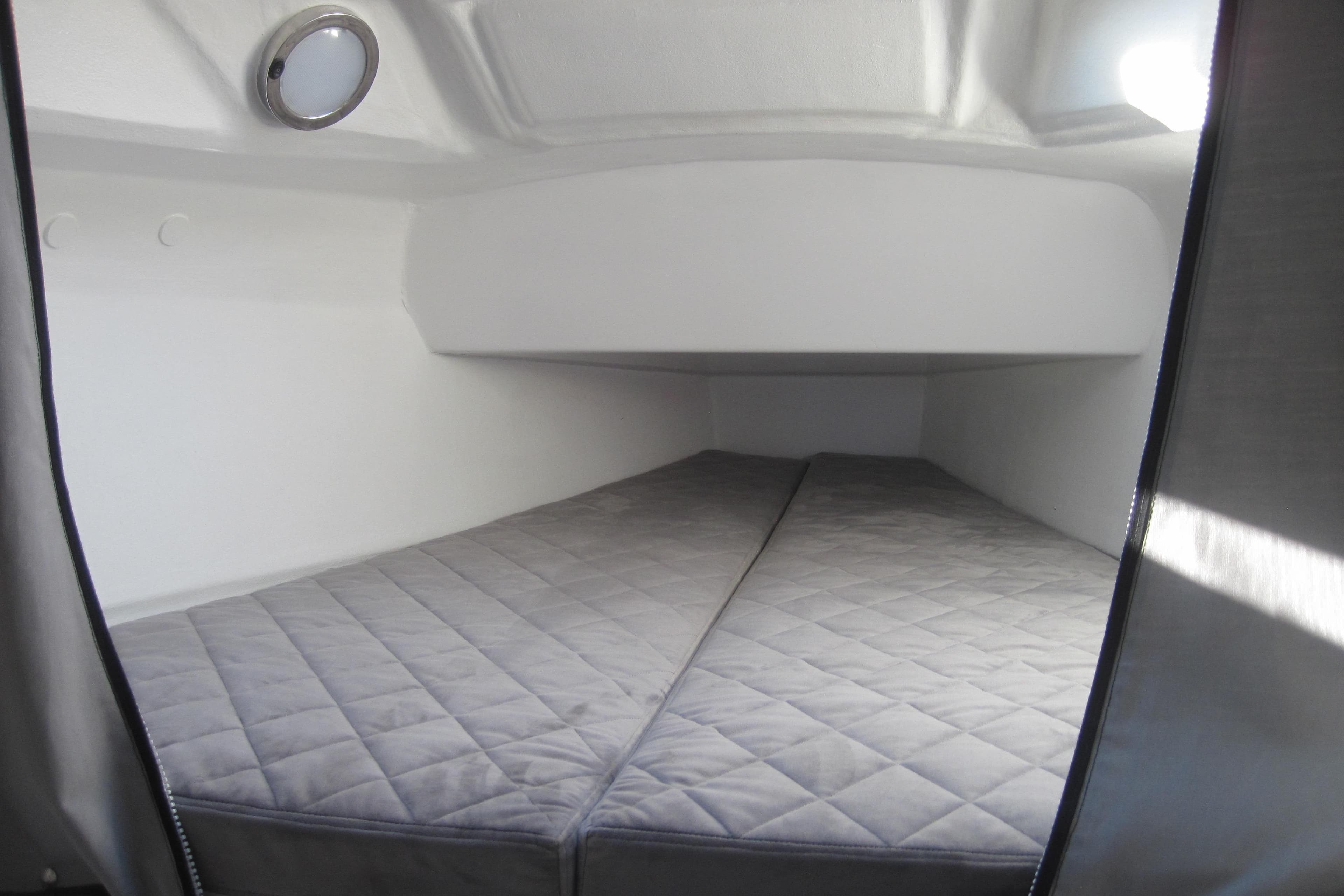 Interior of Corsair 880 Standard 2022 with gray upholstery.