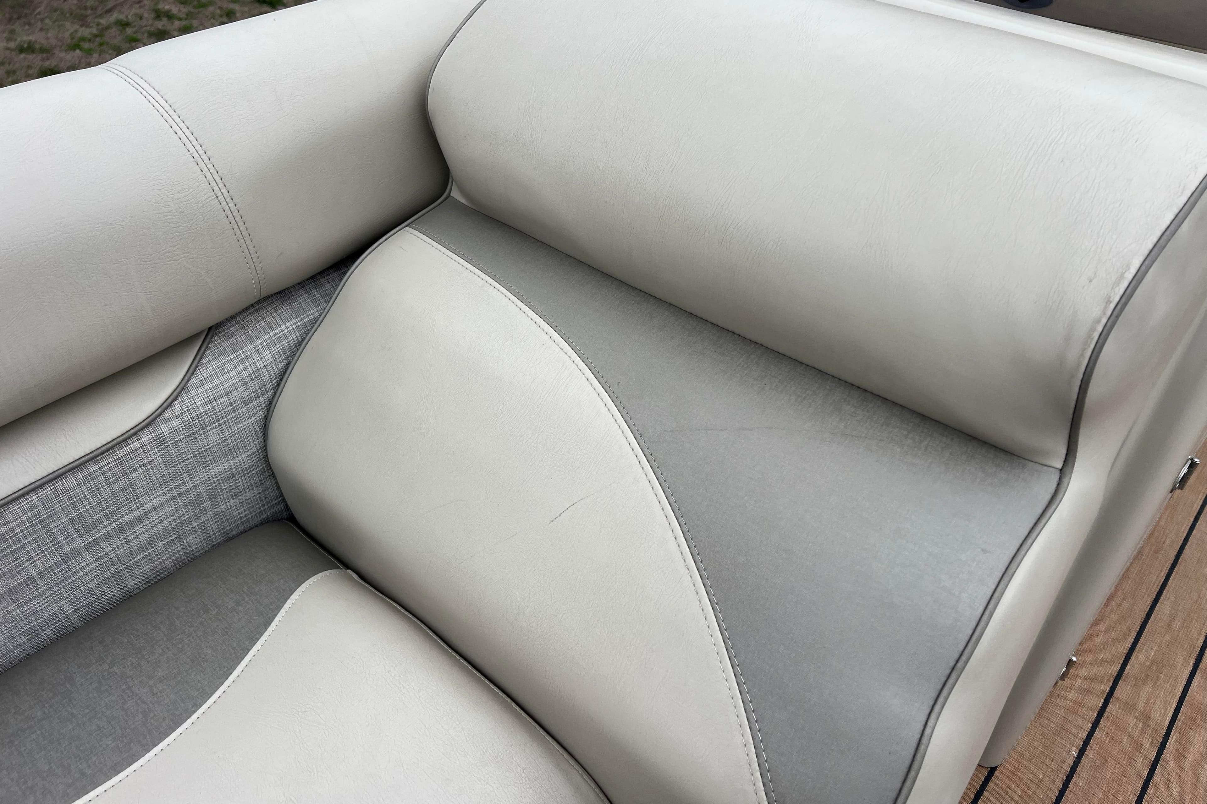 Premier 230 SunSation RF 2017 boat seat with gray and white upholstery.