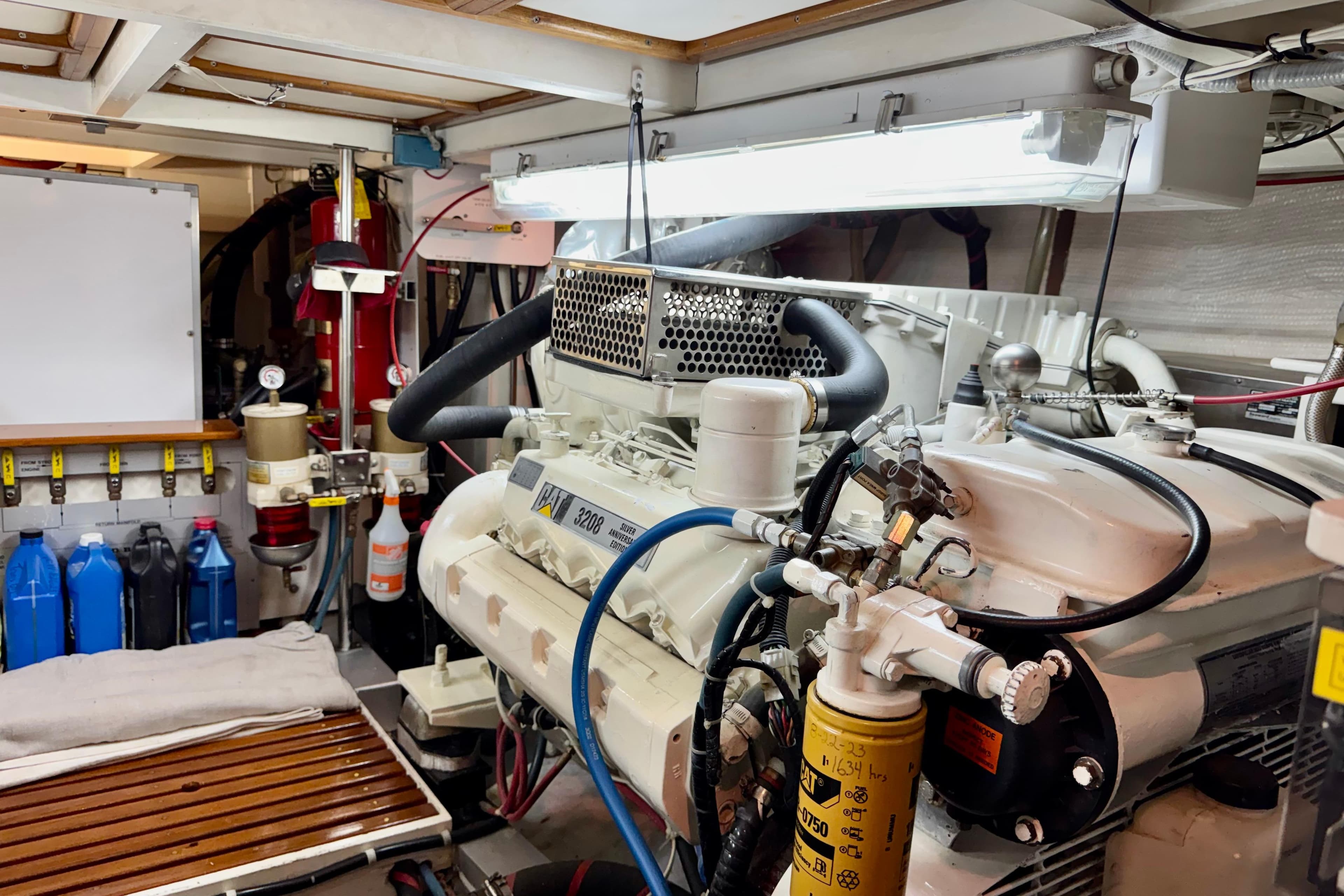 Engine room of a 1996 Grand Banks 46 Heritage CL yacht, featuring a CAT 3208 engine.