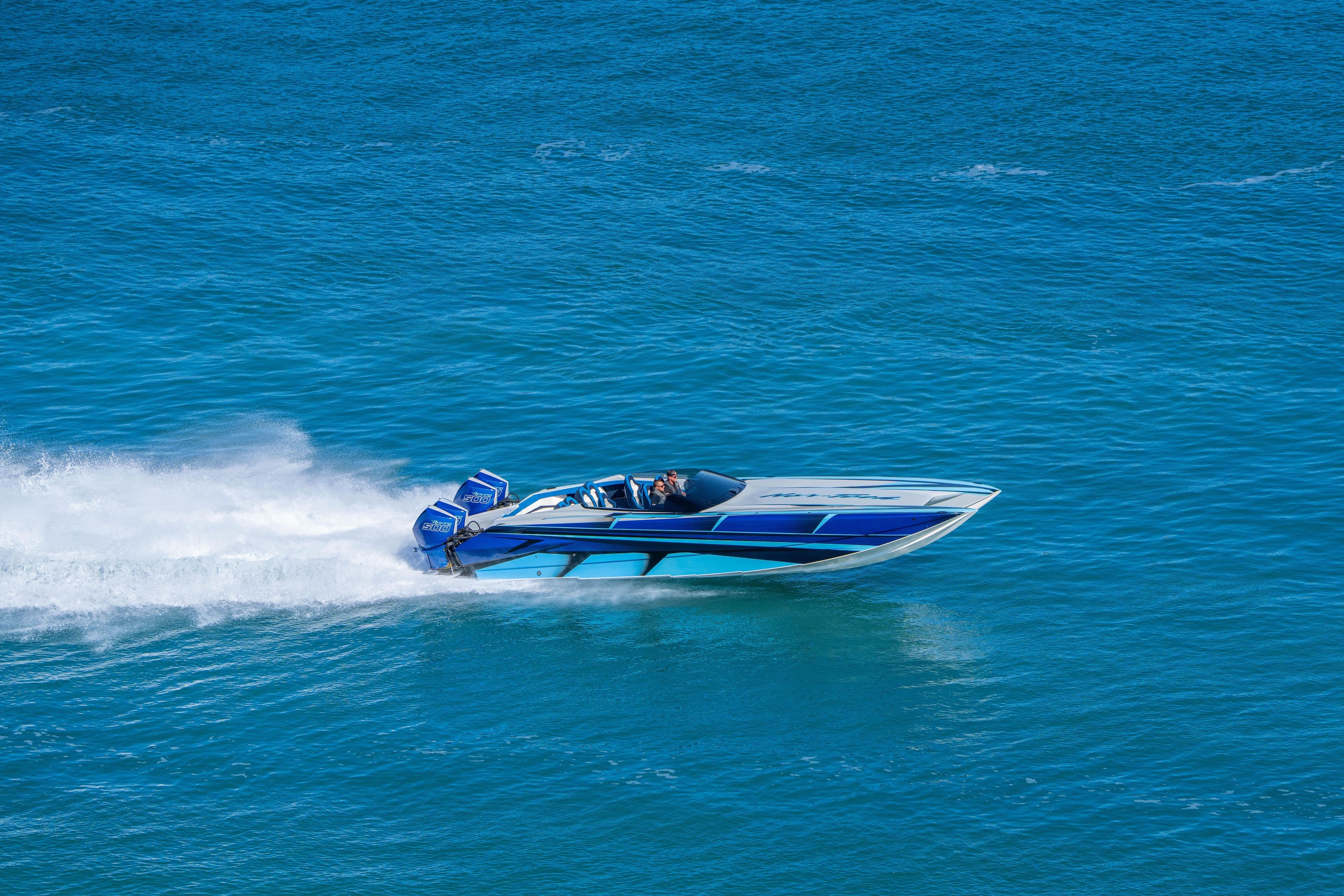 2026 Nor-Tech 4000 Super Catamaran speeding on blue ocean waters.