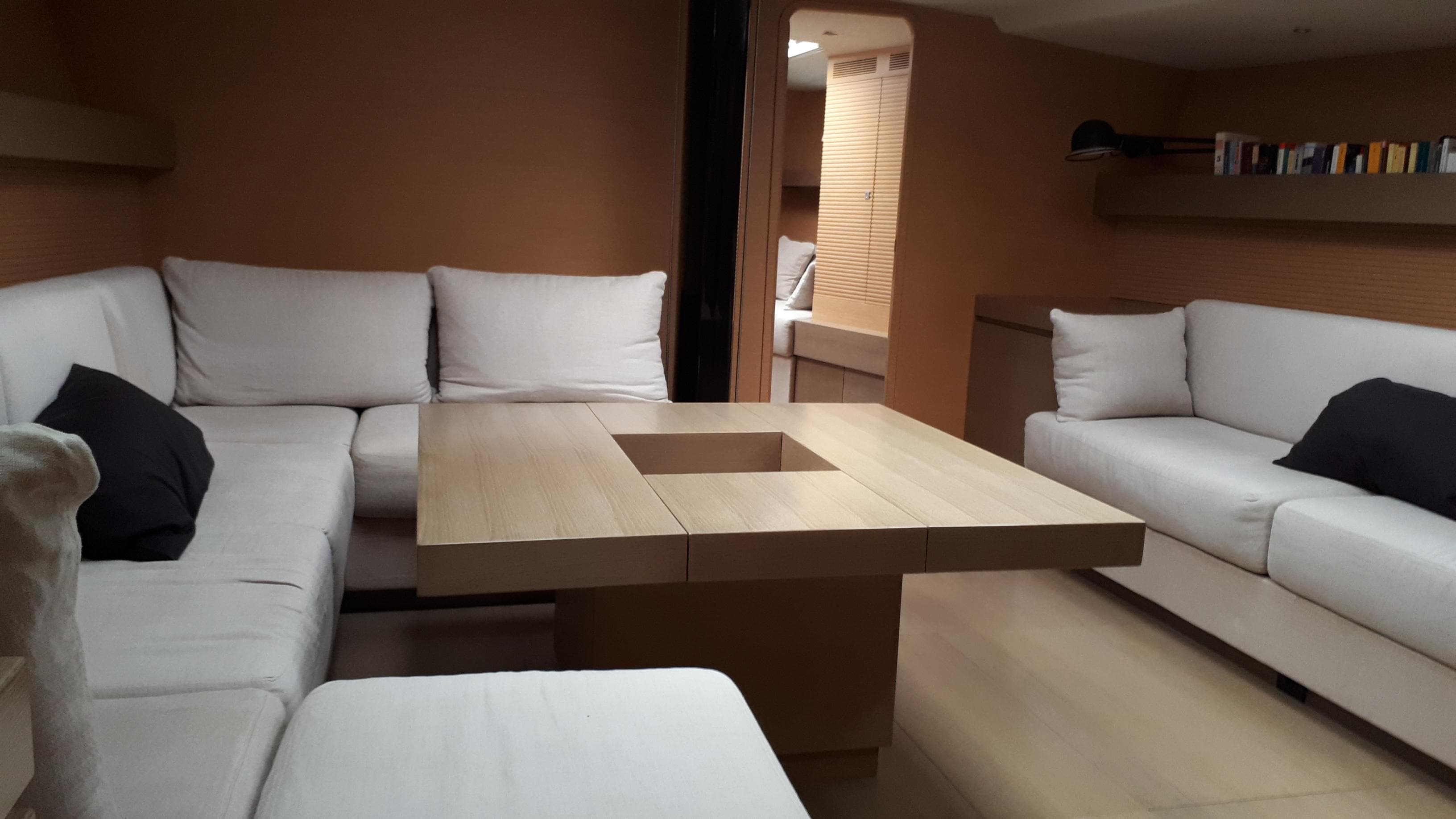 Luxurious interior of 2008 Ice Yachts Felci 71 with modern seating and wooden table.