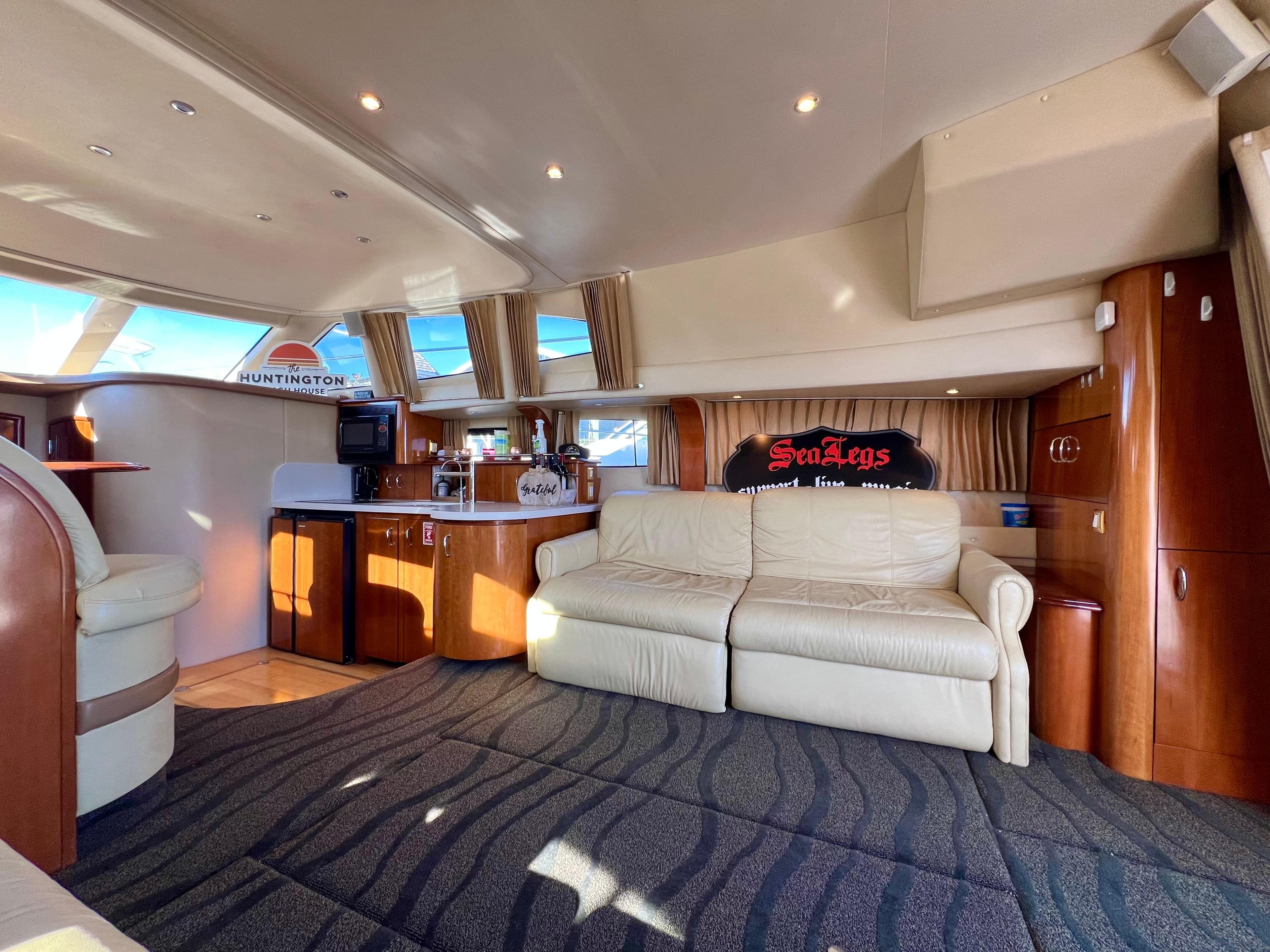 Luxurious interior of 2004 Carver 420 Mariner yacht with plush seating and modern amenities.