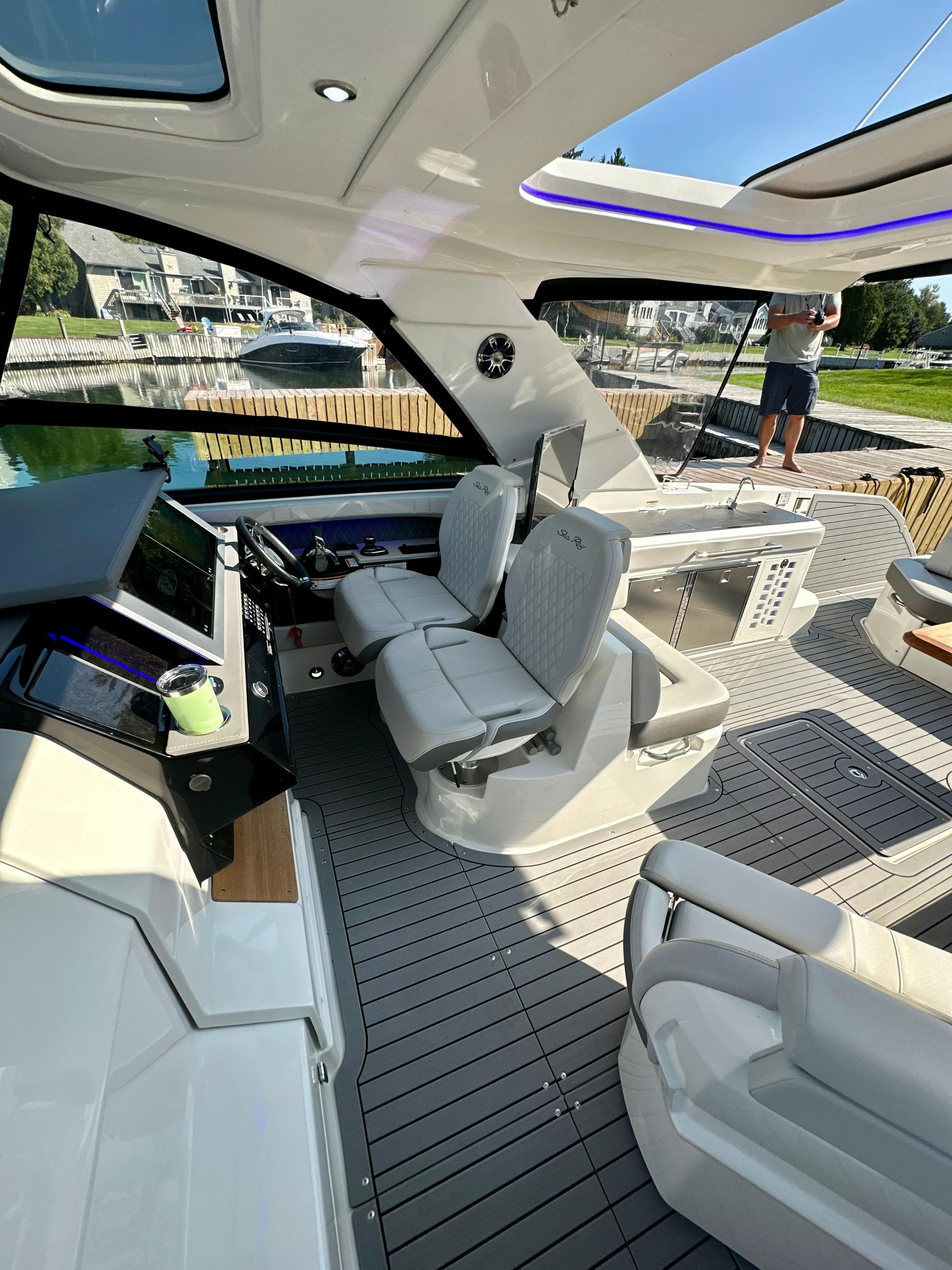2021 Sea Ray SLX 400 Outboard interior with modern helm and seating.