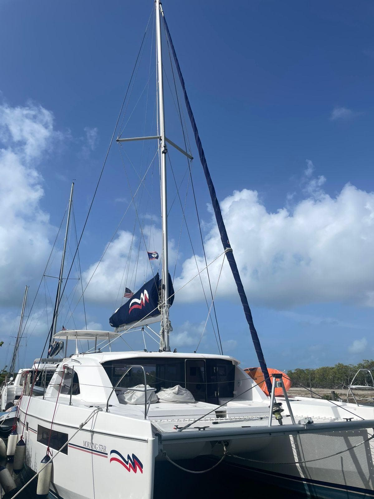 2021 Leopard 40 catamaran docked under a clear blue sky.