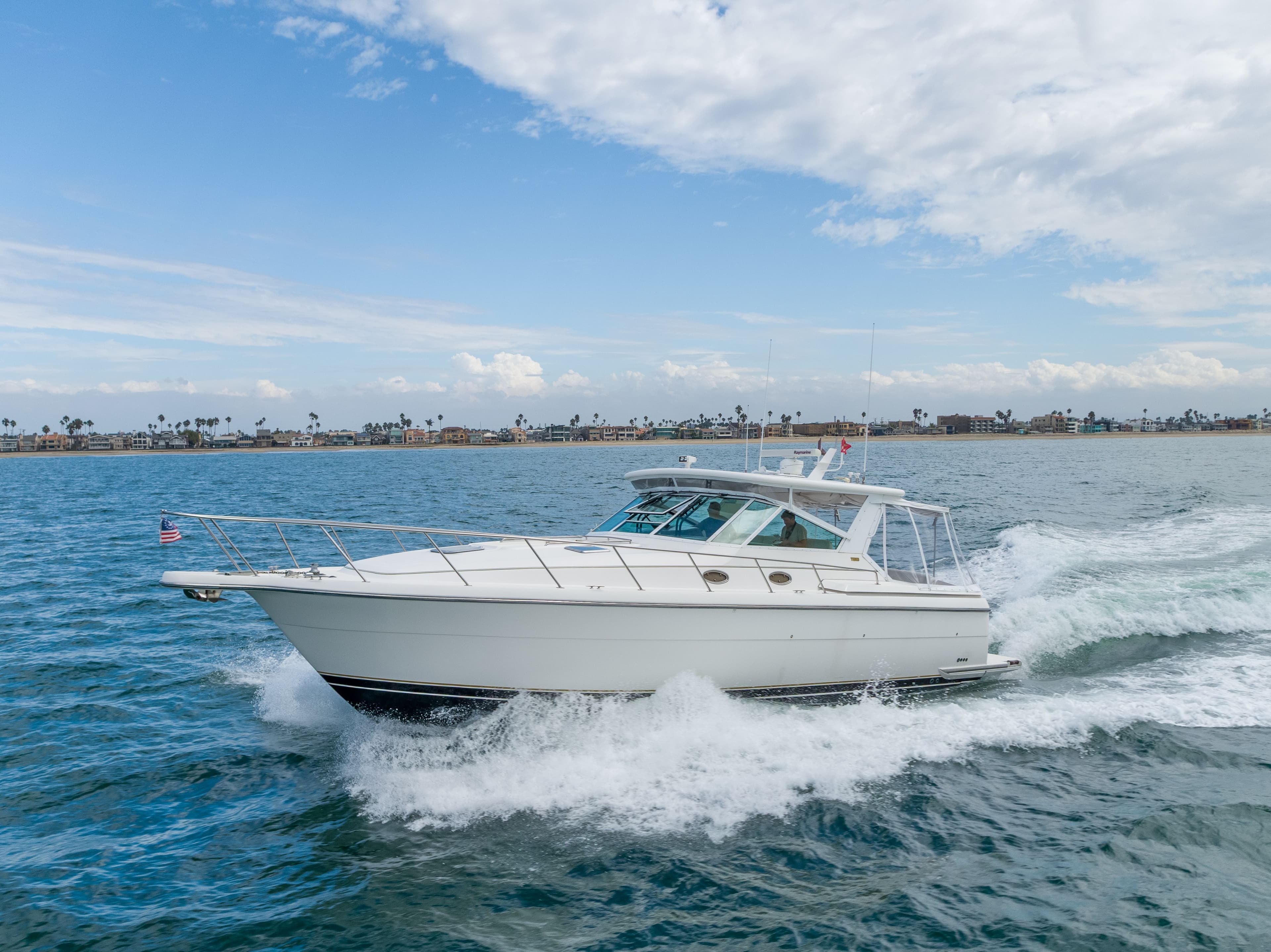 2004 Tiara Yachts 4000 cruising on open sea under clear skies.