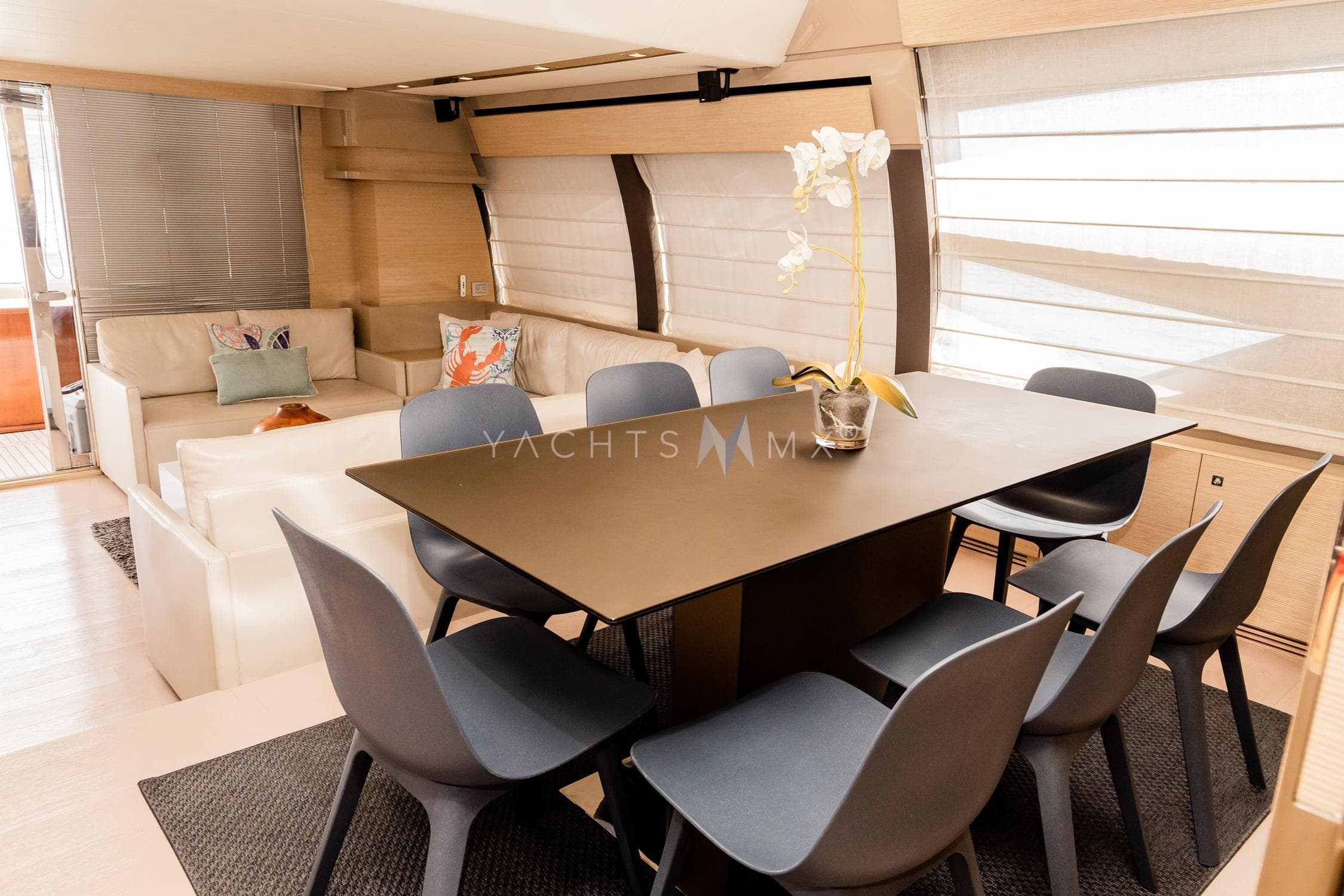 Luxurious interior of 2013 Ferretti Yachts 730 with modern dining area and elegant decor.