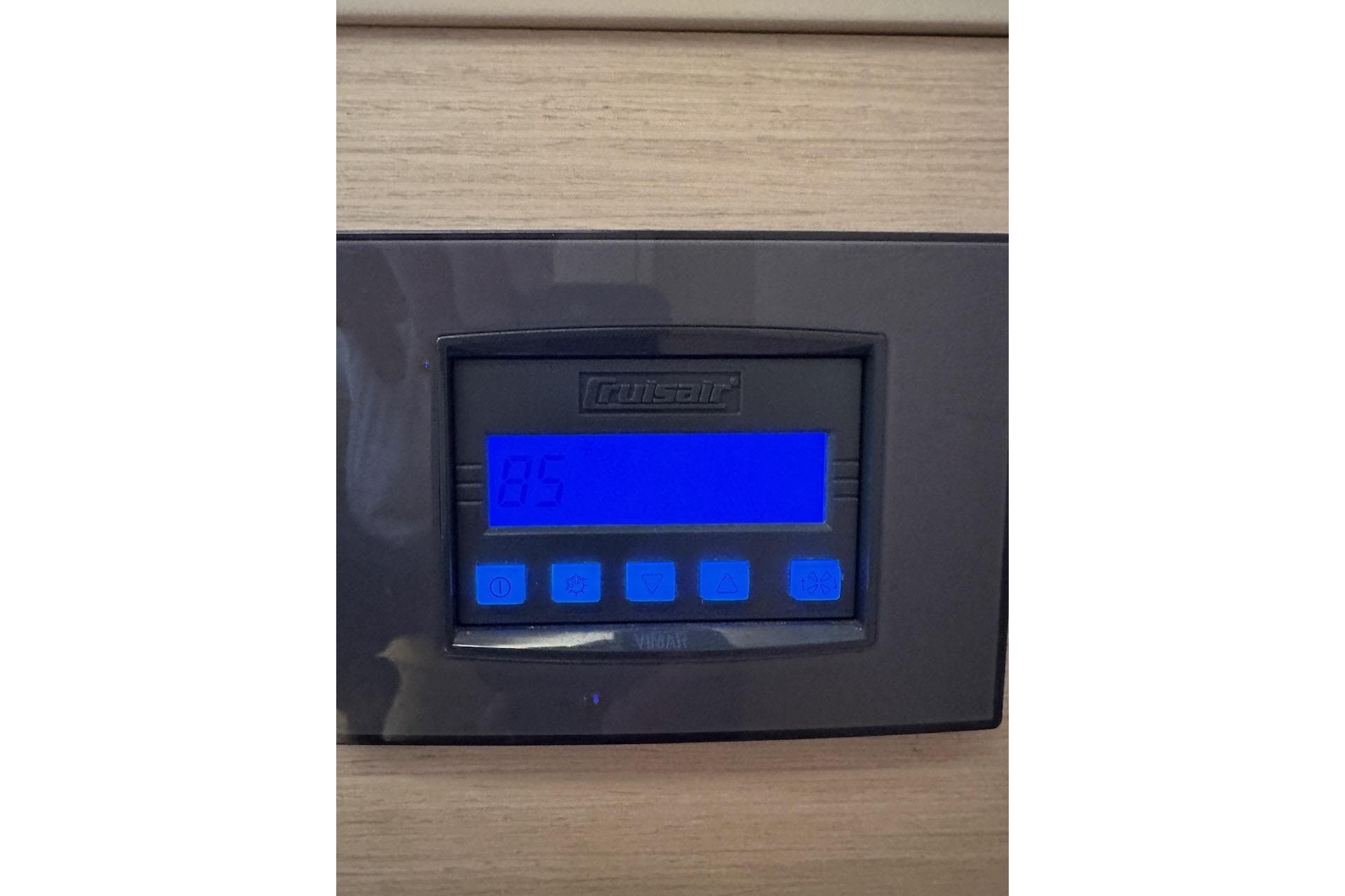 Digital control panel on 2023 Lagoon 46 yacht displaying temperature settings.