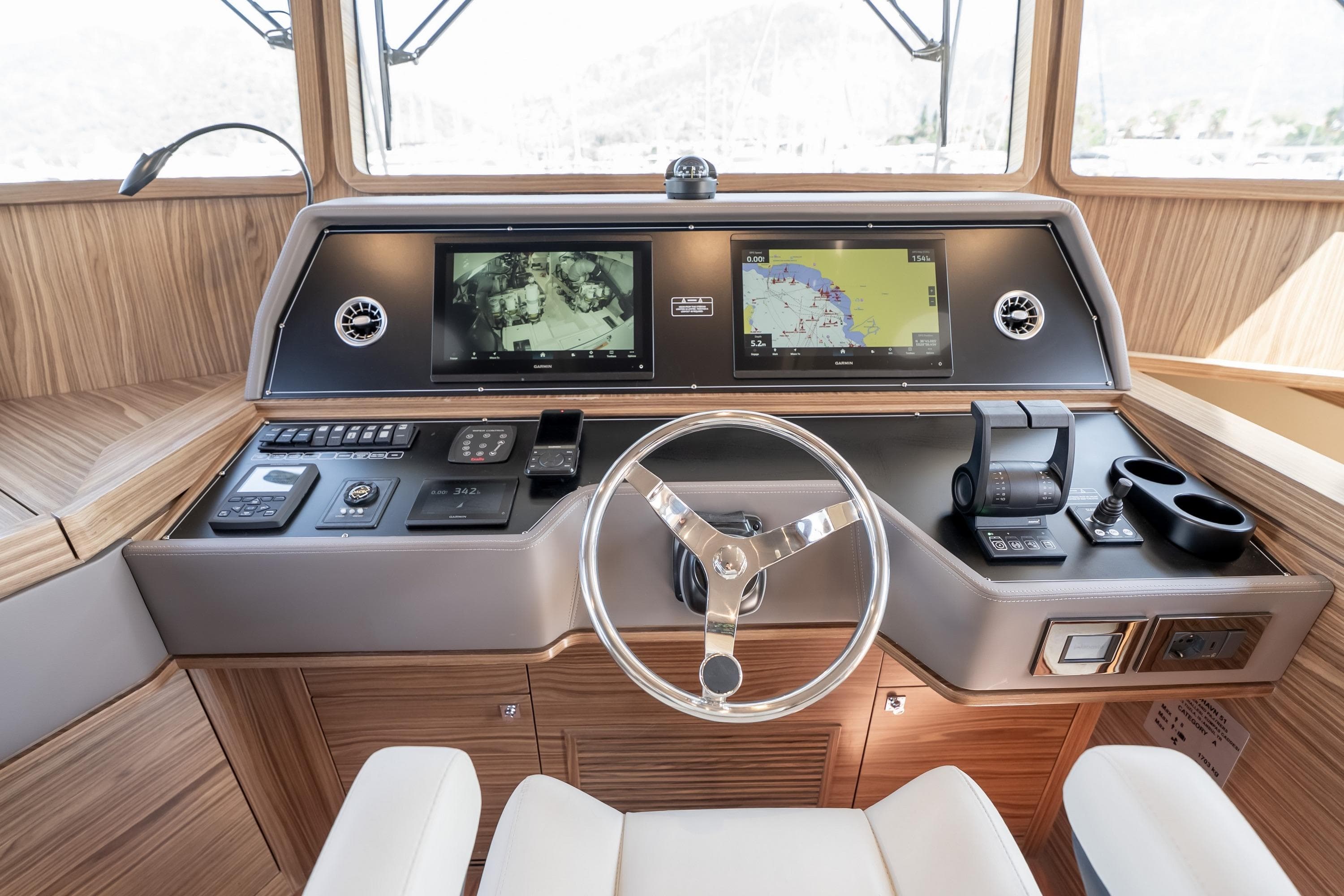 2024 Nordhavn 51 yacht helm with navigation screens and controls.