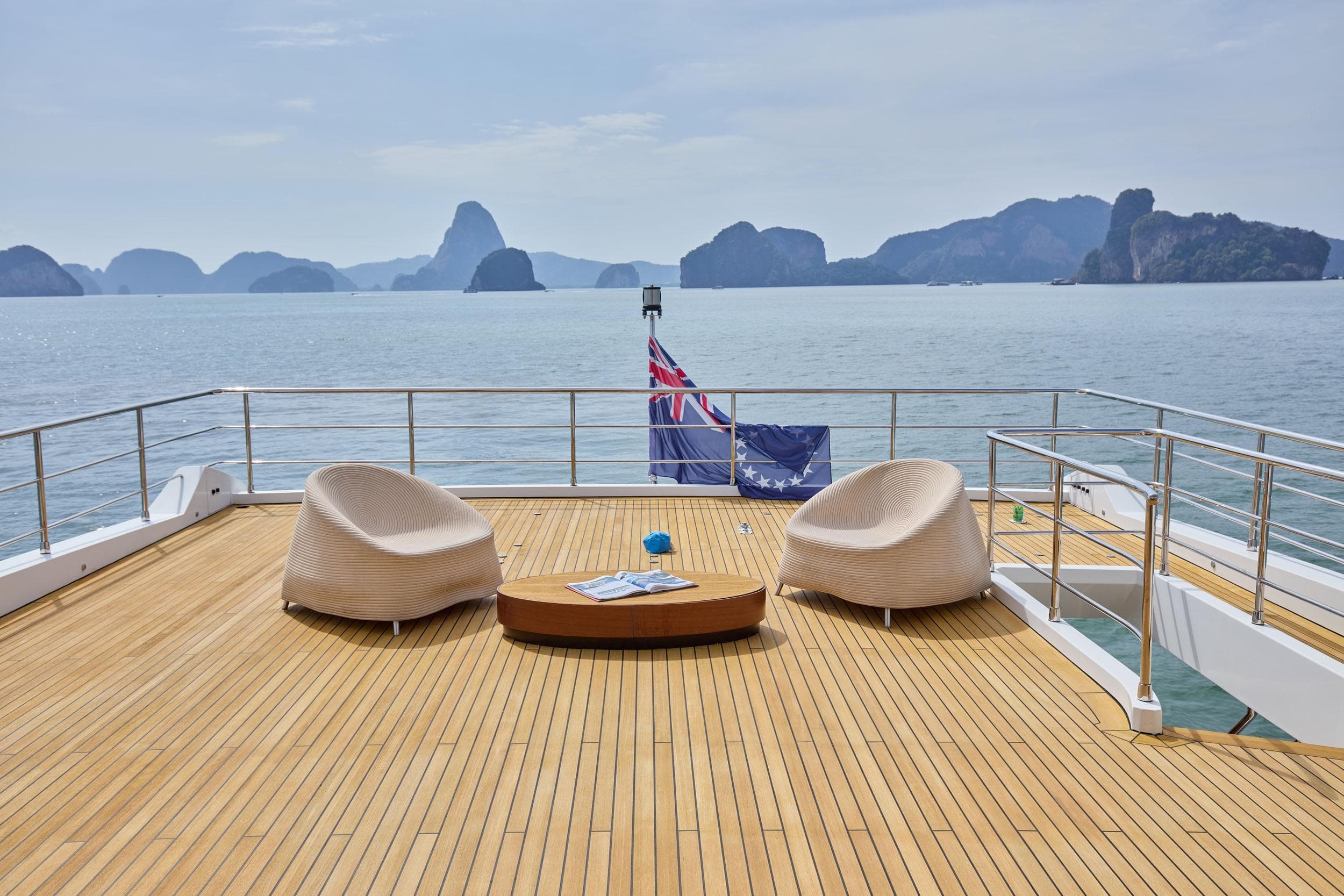 Luxurious deck of 2022 Azimut Grande 32M yacht with ocean view and seating.