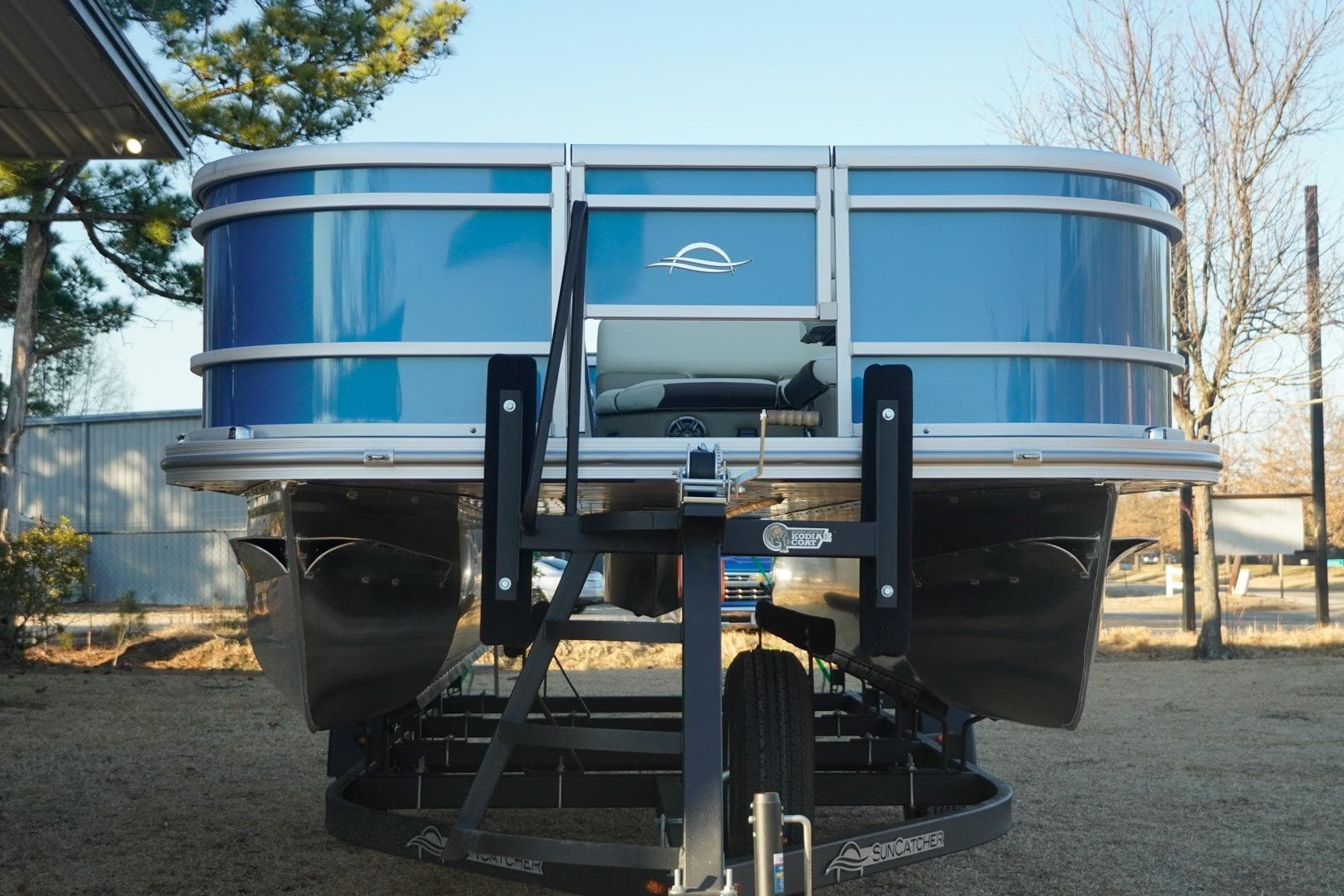2026 SunCatcher Select 20F pontoon boat on trailer, front view.