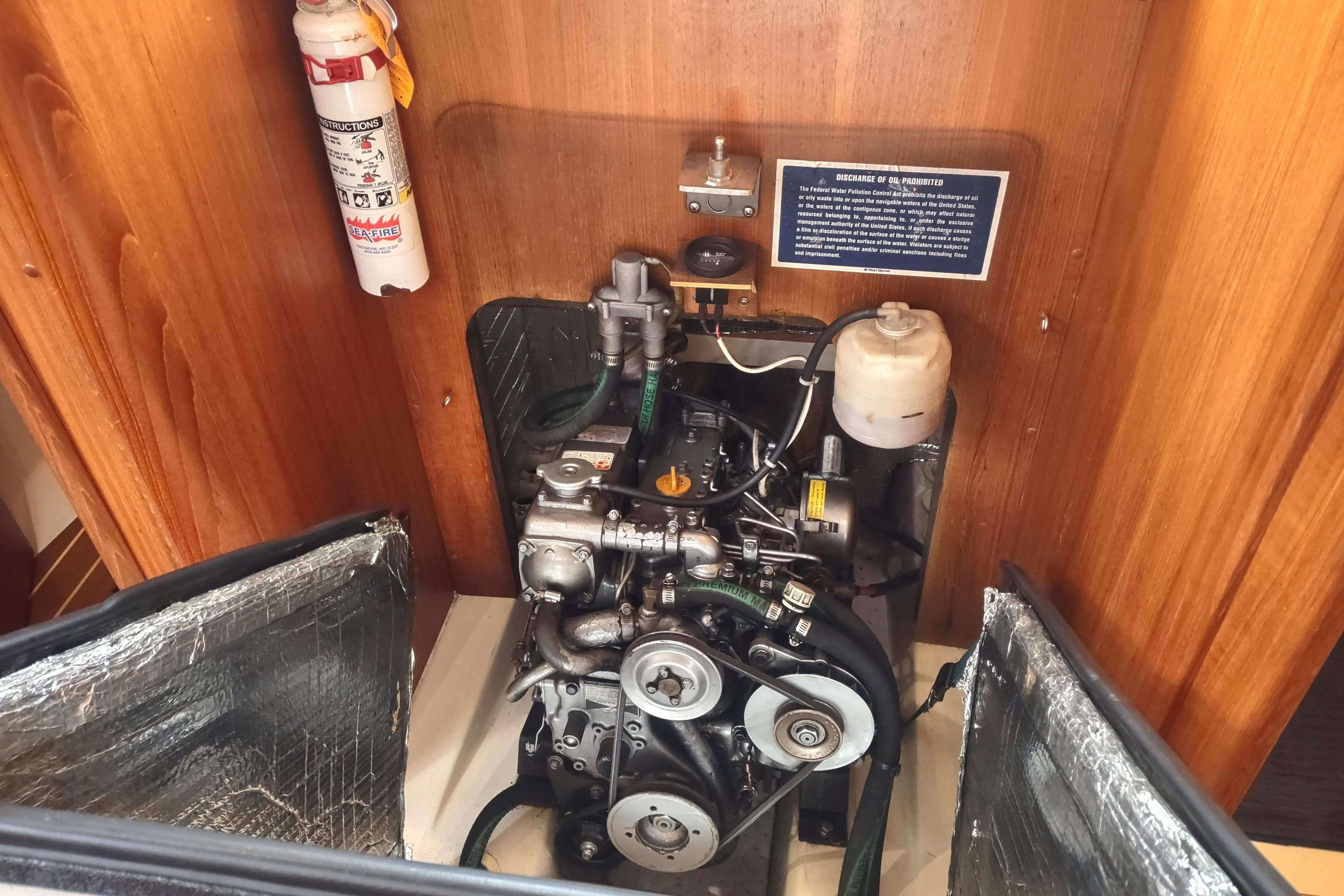 Engine compartment of a 2003 Hunter 356 sailboat, featuring a compact marine engine.