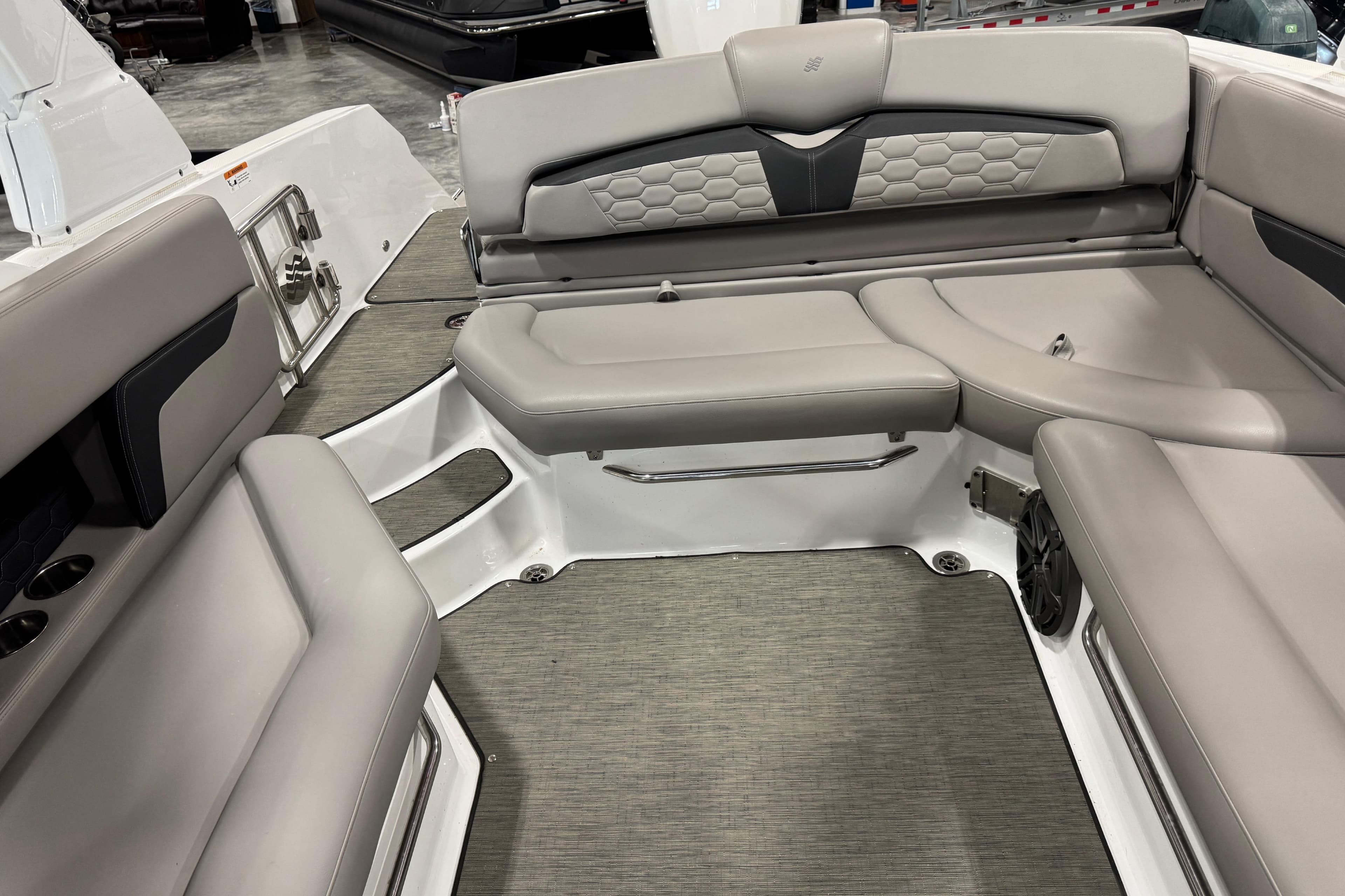 2023 Four Winns HD8 OB boat interior with gray seating and modern design.