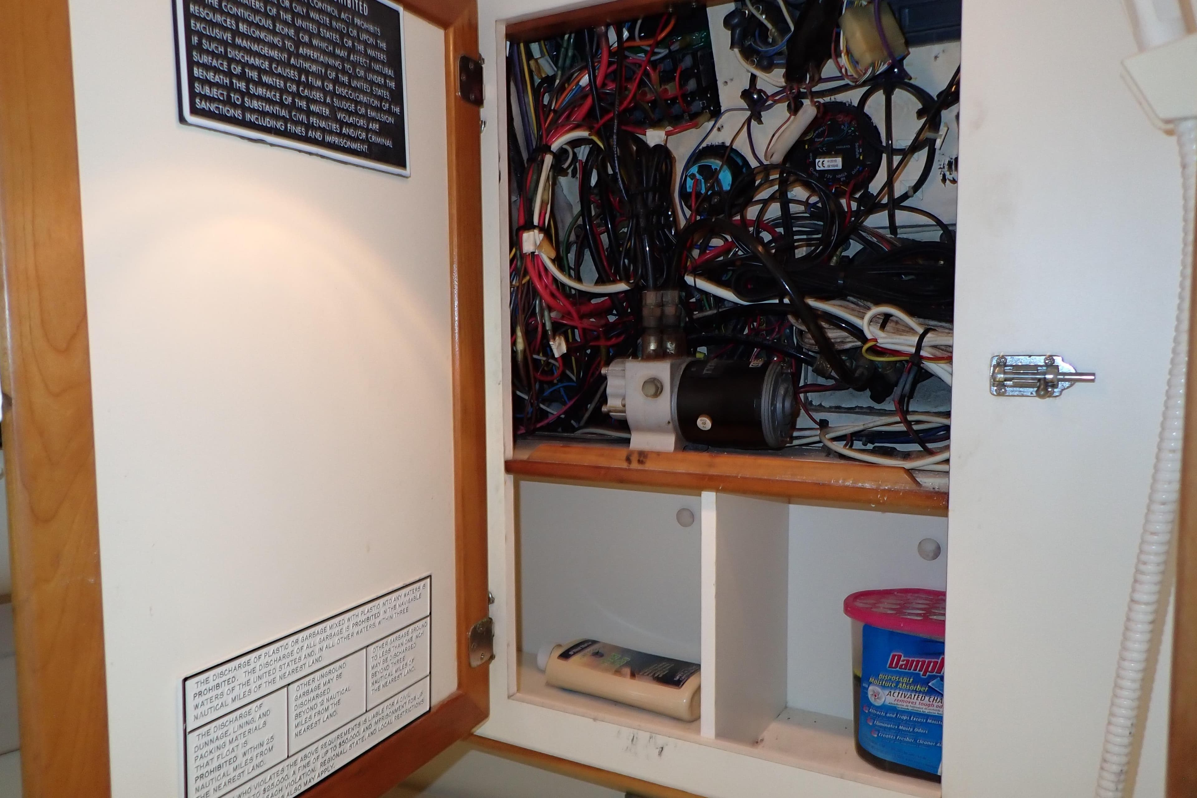 Electrical panel inside a 2000 Albin 28 Tournament Express boat, showcasing wiring and components.