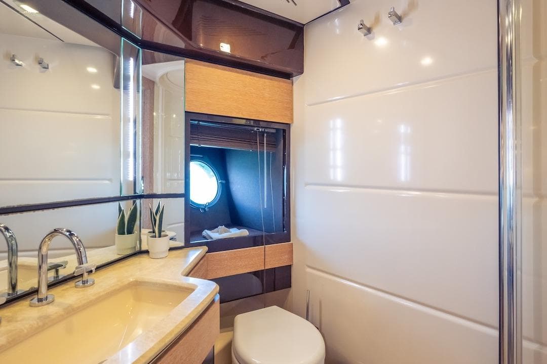 Luxurious 2012 Azimut Evolution yacht bathroom with modern fixtures and elegant design.