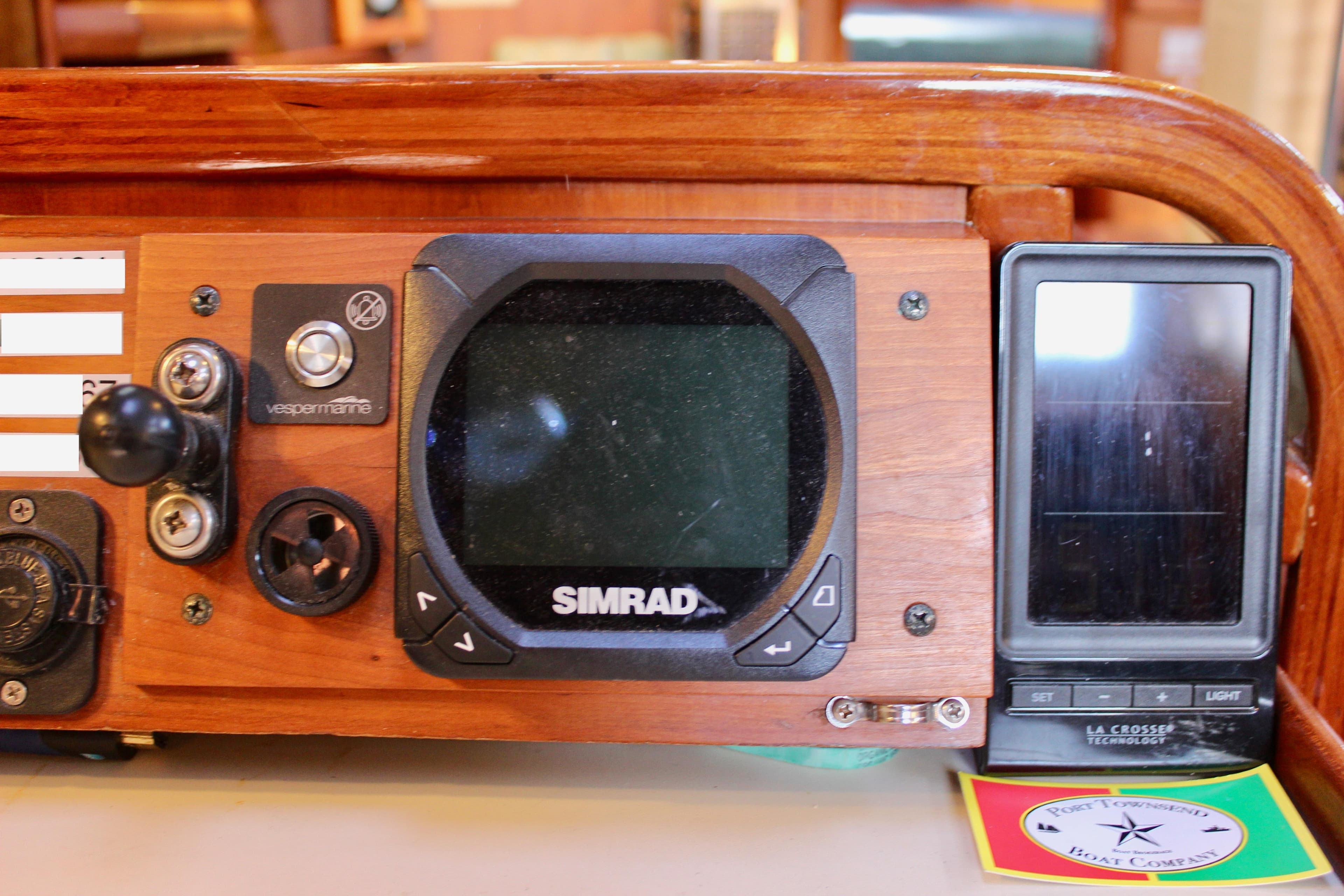 Control panel of a 1997 Valiant 39 boat with Simrad navigation system.
