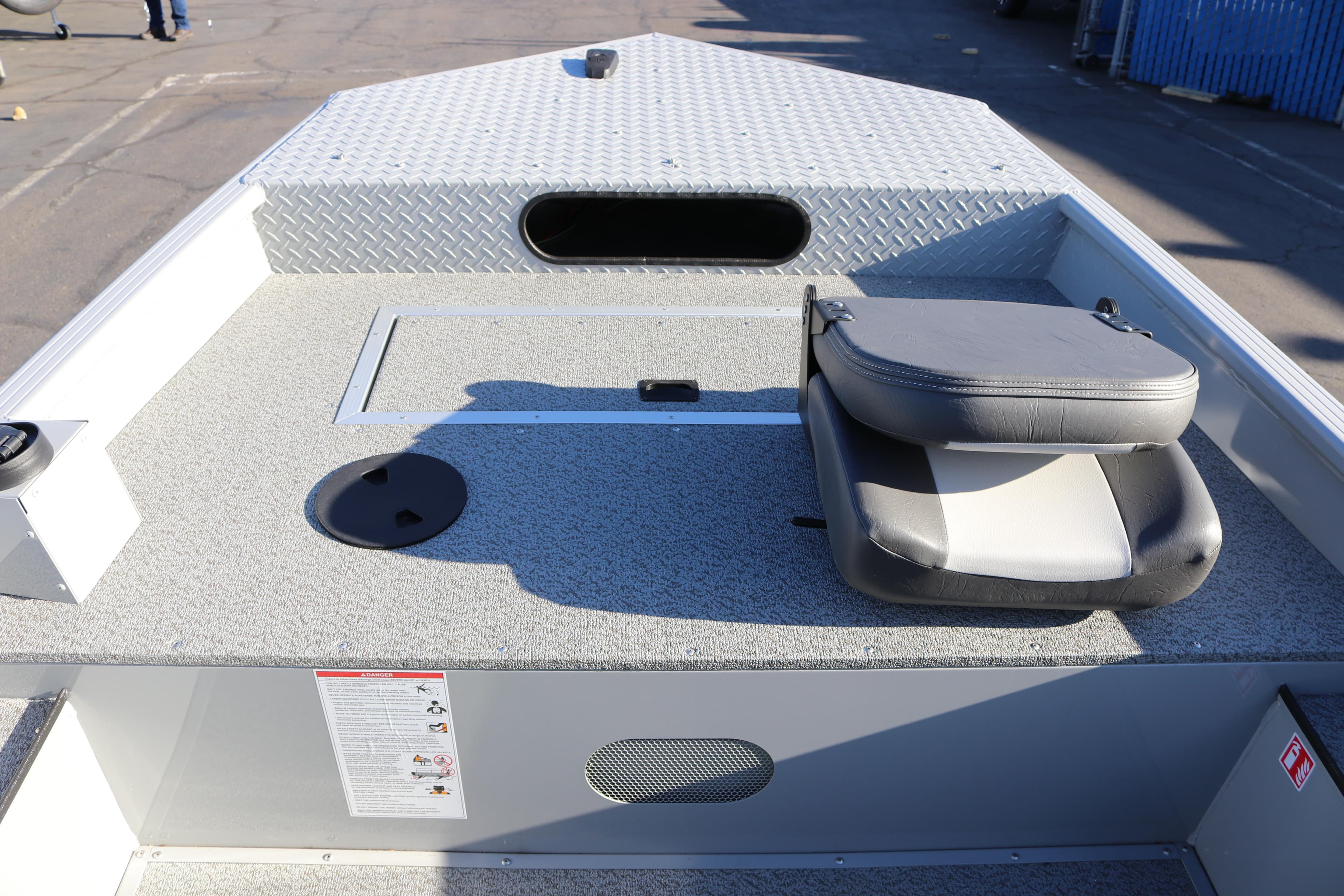 2026 Smoker Craft Pro Sportsman 1660 boat interior with seating and storage compartments.