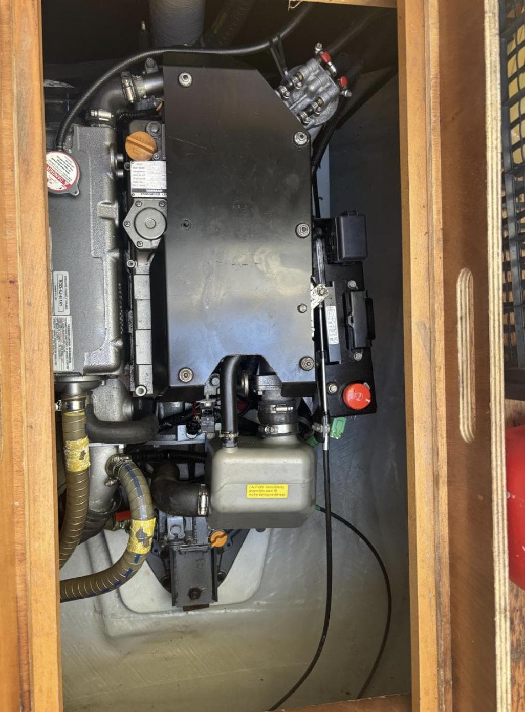 Engine compartment of a 2016 Lagoon 450 F catamaran, showcasing mechanical components.
