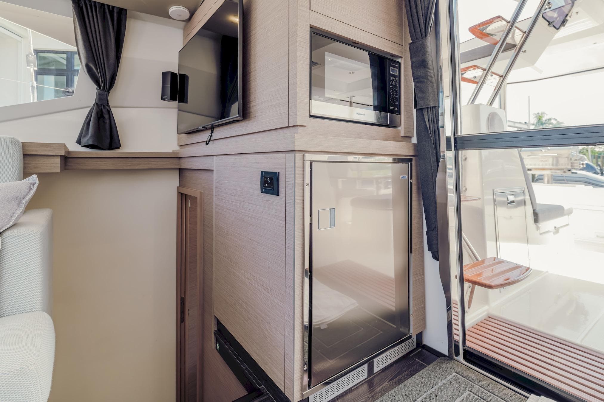 Interior of 2020 Fountaine Pajot Saona 47 yacht with modern kitchen appliances.