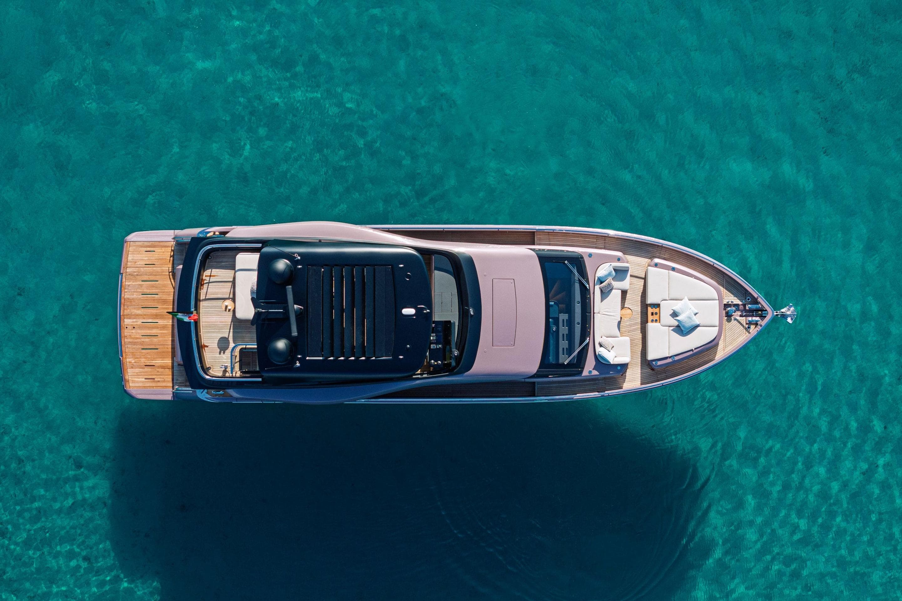 Aerial view of 2026 Cranchi Sessantadue 62 yacht on clear turquoise water.