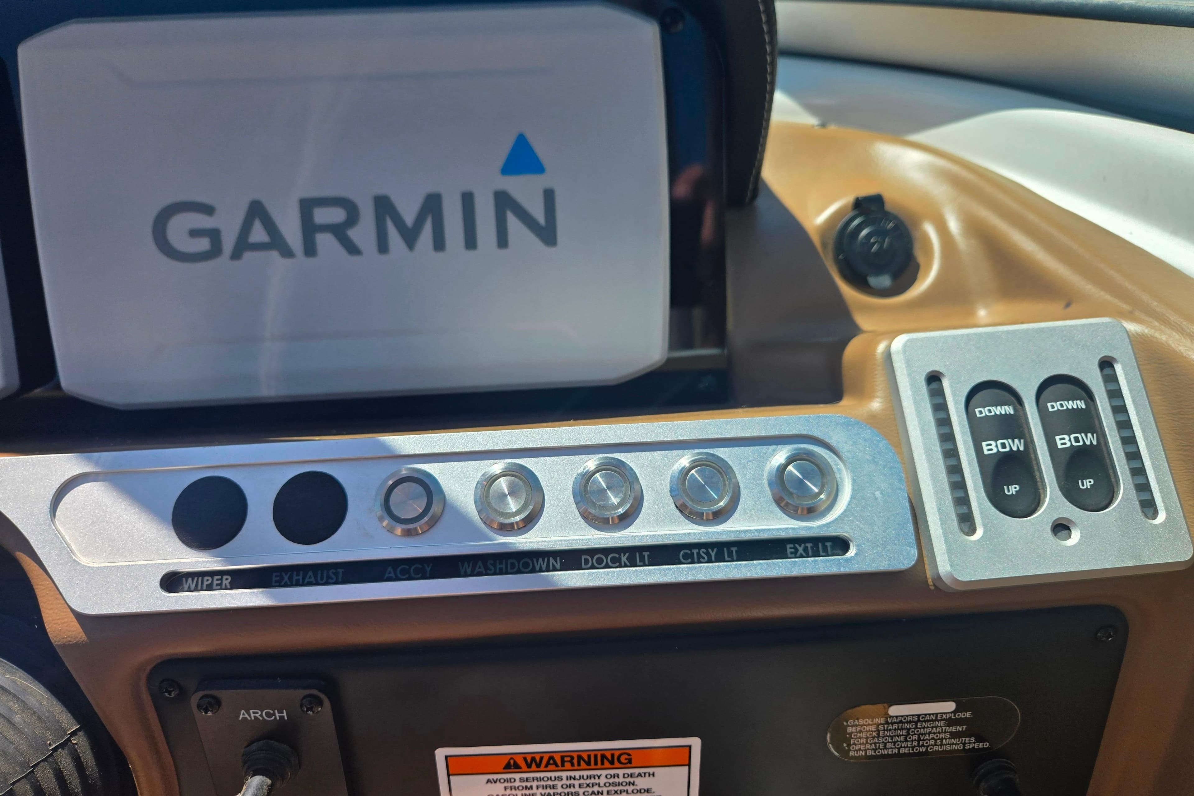 Dashboard of 2021 Crownline Eclipse E235 with Garmin display and control switches.