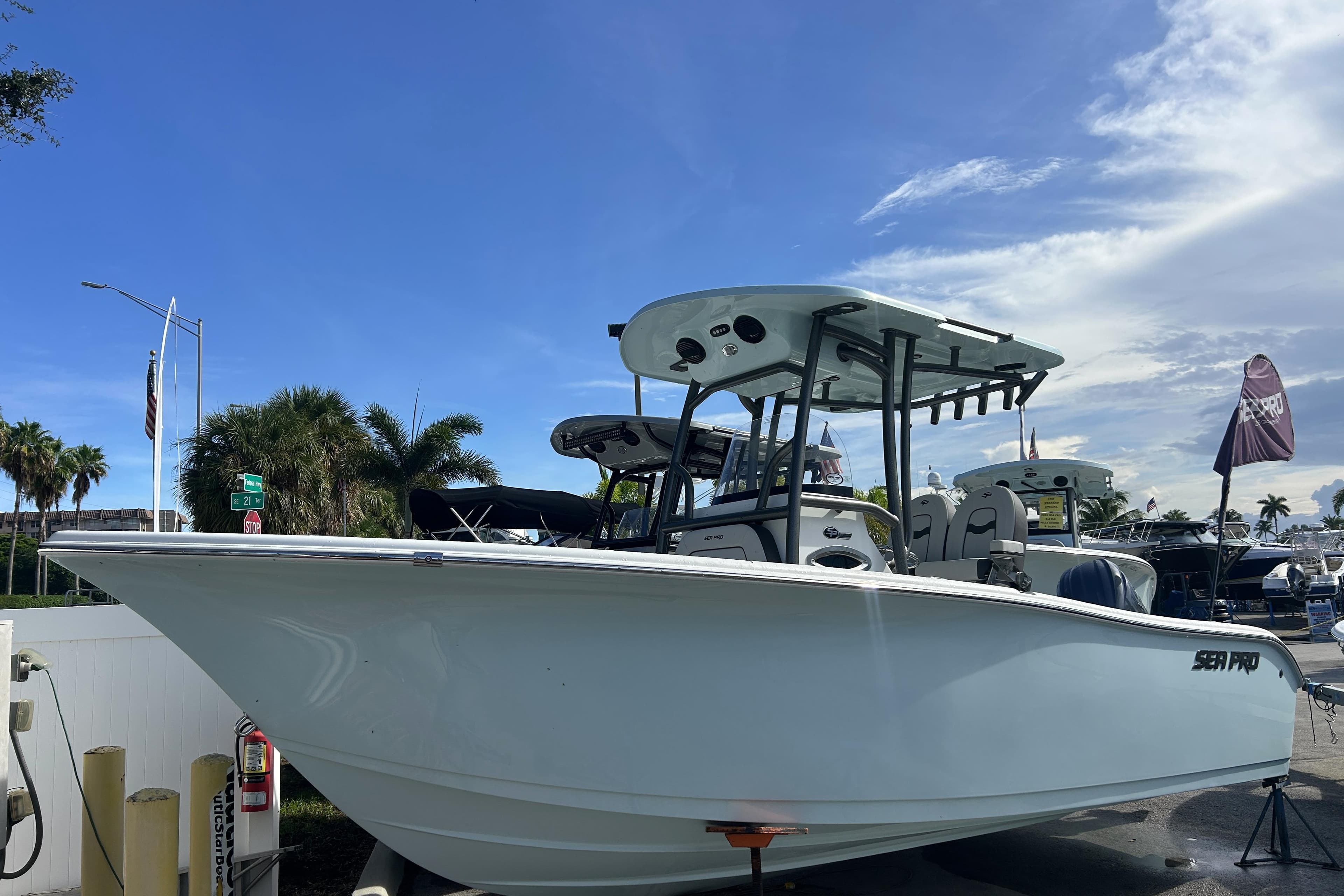 2026 Sea Pro 222 Center Console boat displayed outdoors under a clear blue sky.