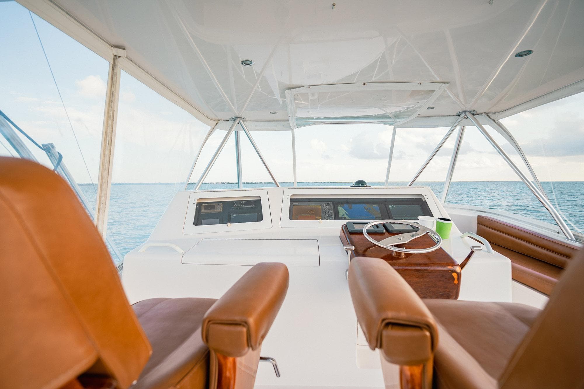 2005 Viking 48 Convertible yacht helm with ocean view and leather seats.