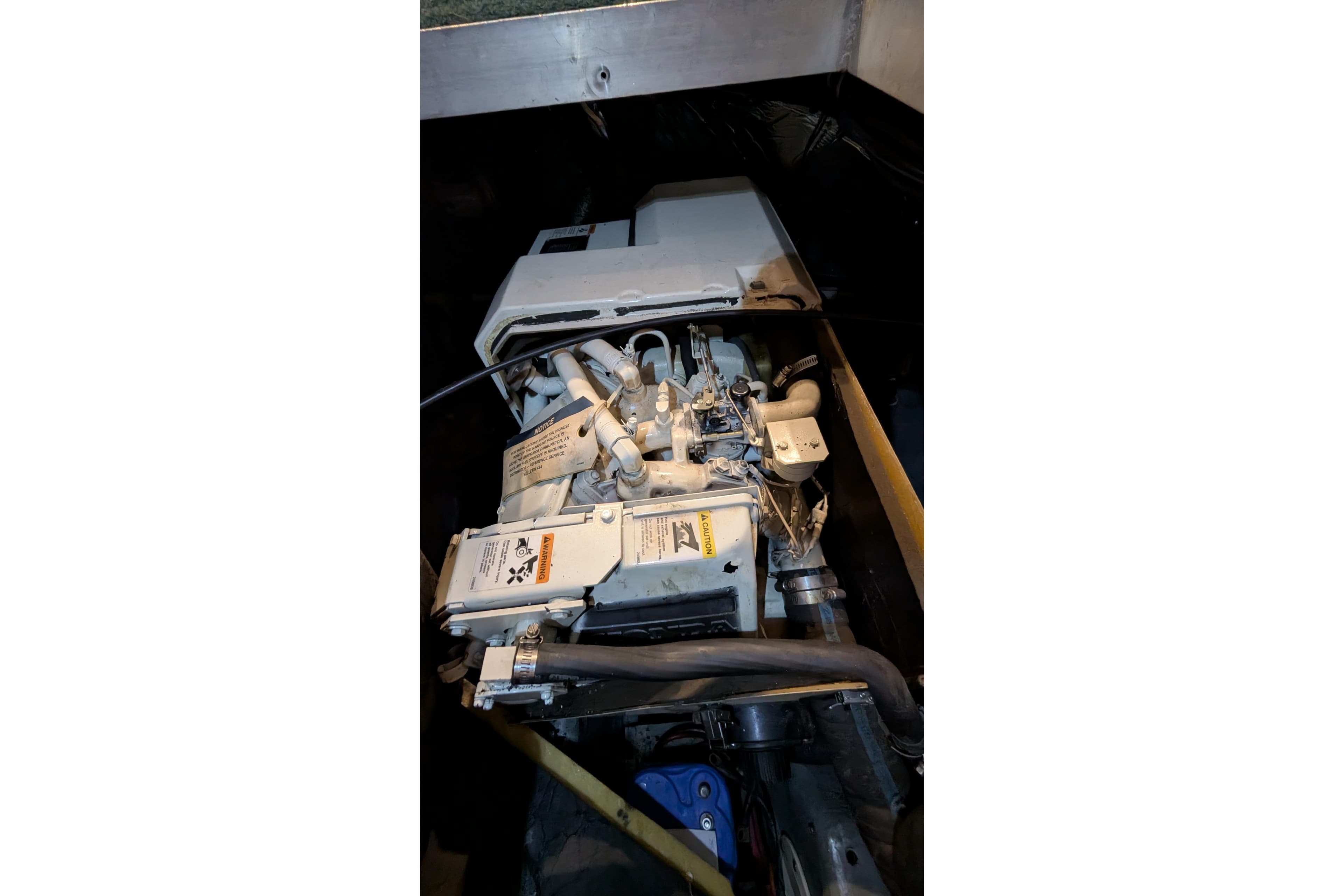 Engine compartment of 1996 Carver 355 Aft Cabin Motor Yacht, showcasing mechanical components.