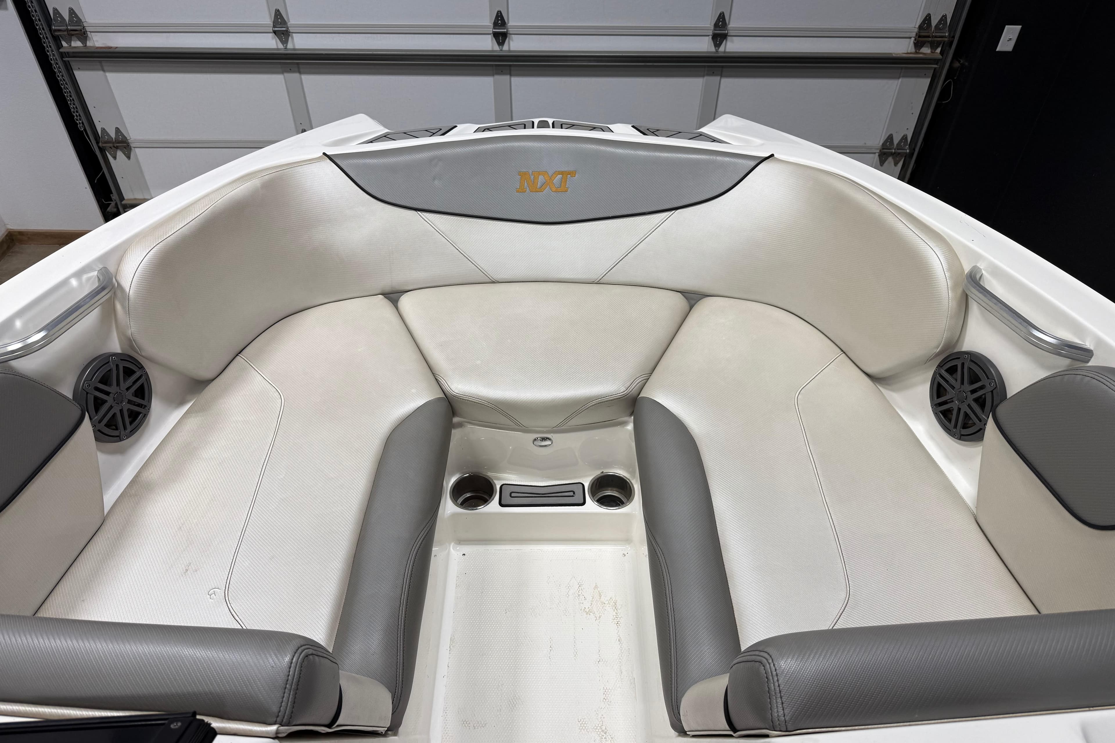 2017 MasterCraft NXT22 boat interior with gray and white seating.