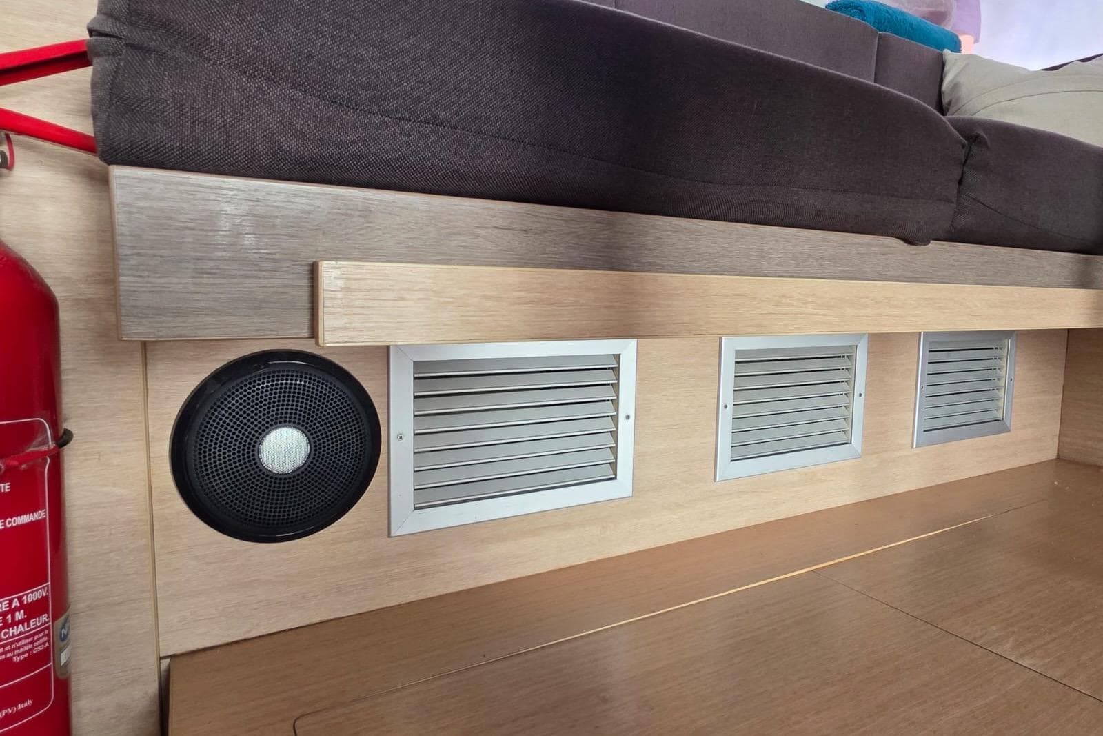 Interior of a 2016 Bali 4.5 yacht with speaker, vents, and fire extinguisher.