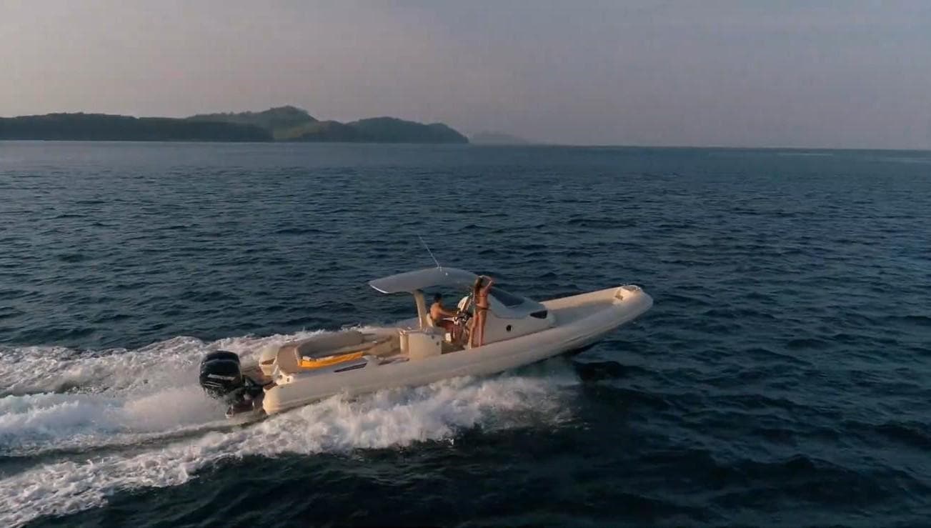 2019 SACS Strider 11 cruising on open water at sunset.