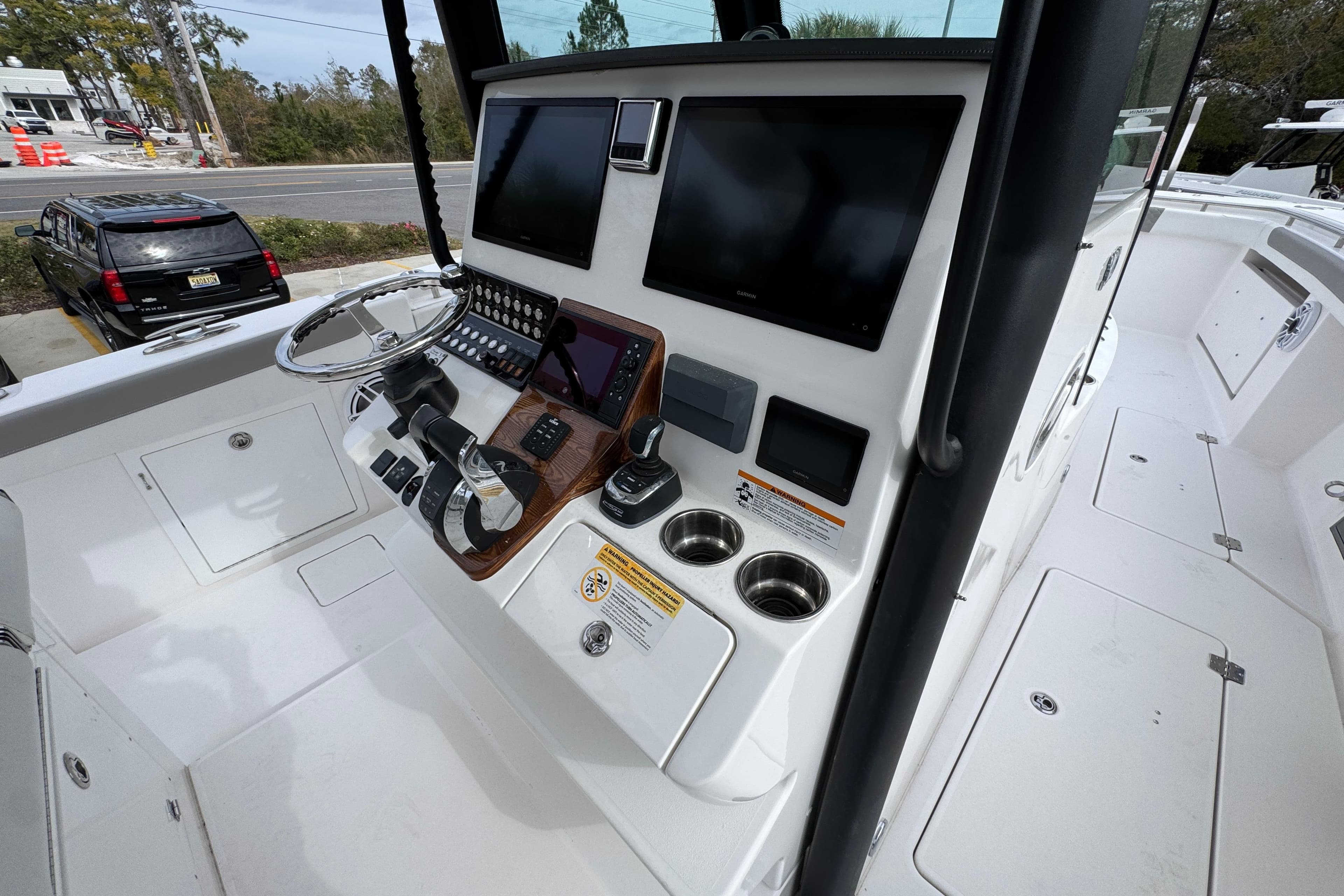 2024 Caymas 34 CT boat helm with modern controls and navigation screens.