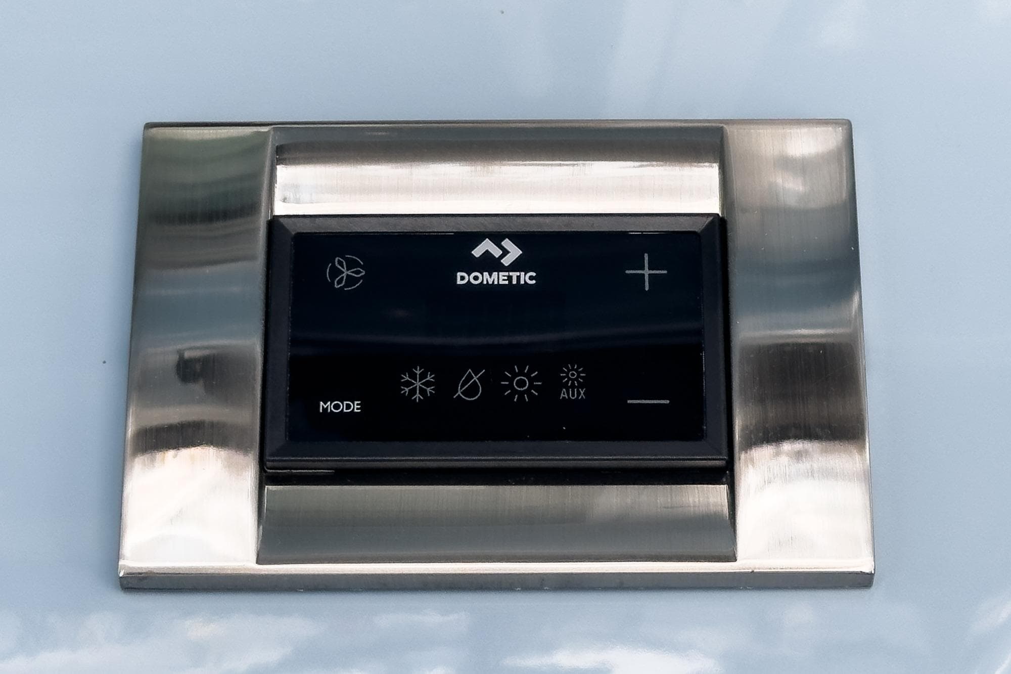 Control panel on 2024 Boston Whaler 325 Conquest boat, featuring Dometic interface.