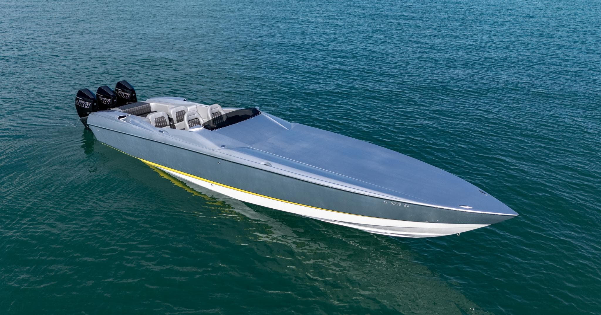 2017 Nor-Tech 3900 Super-VEE speedboat on calm blue water.