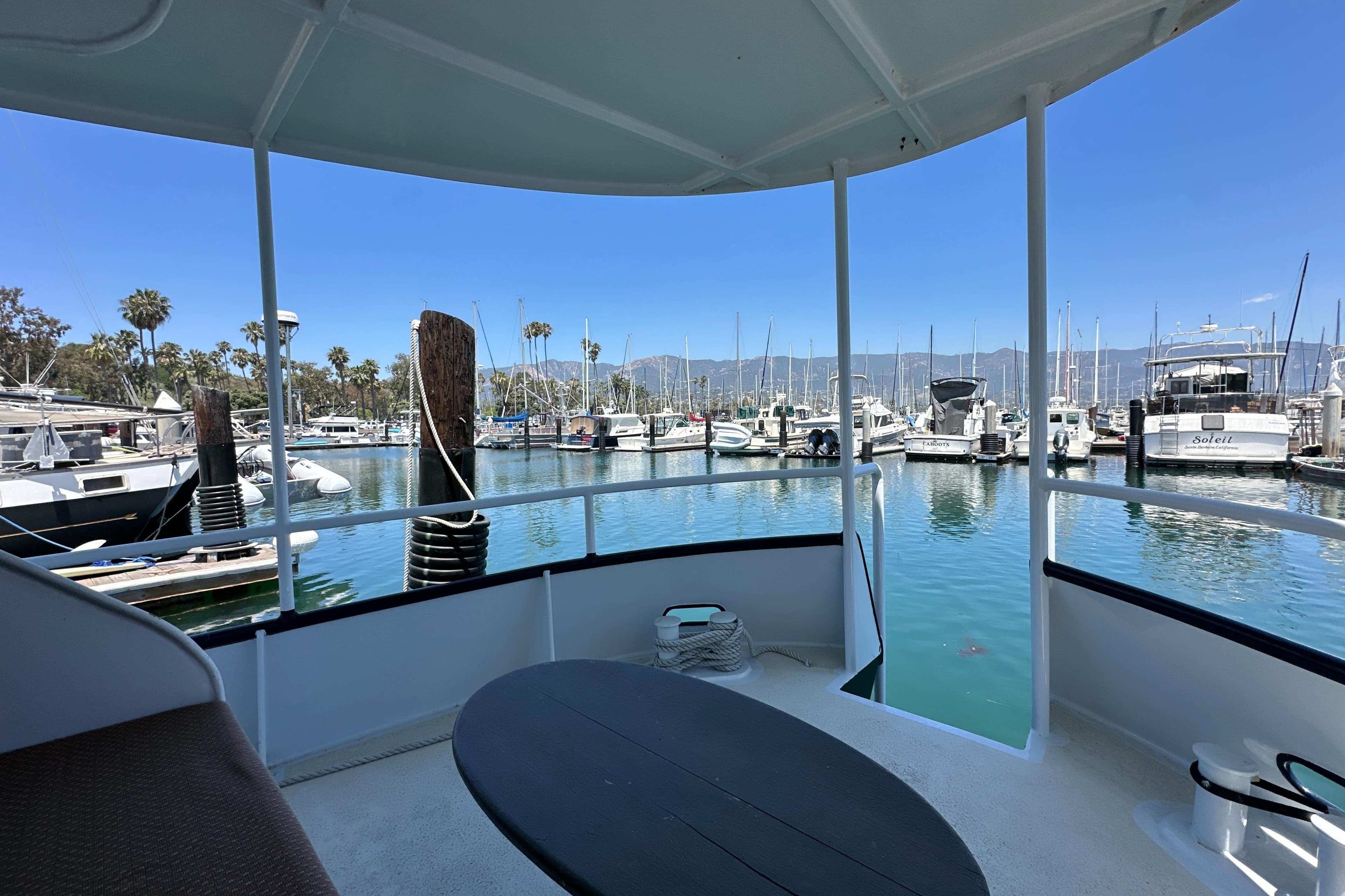 View from Custom Pacific Northwest 43 yacht, 2012, overlooking marina with boats and clear blue sky.